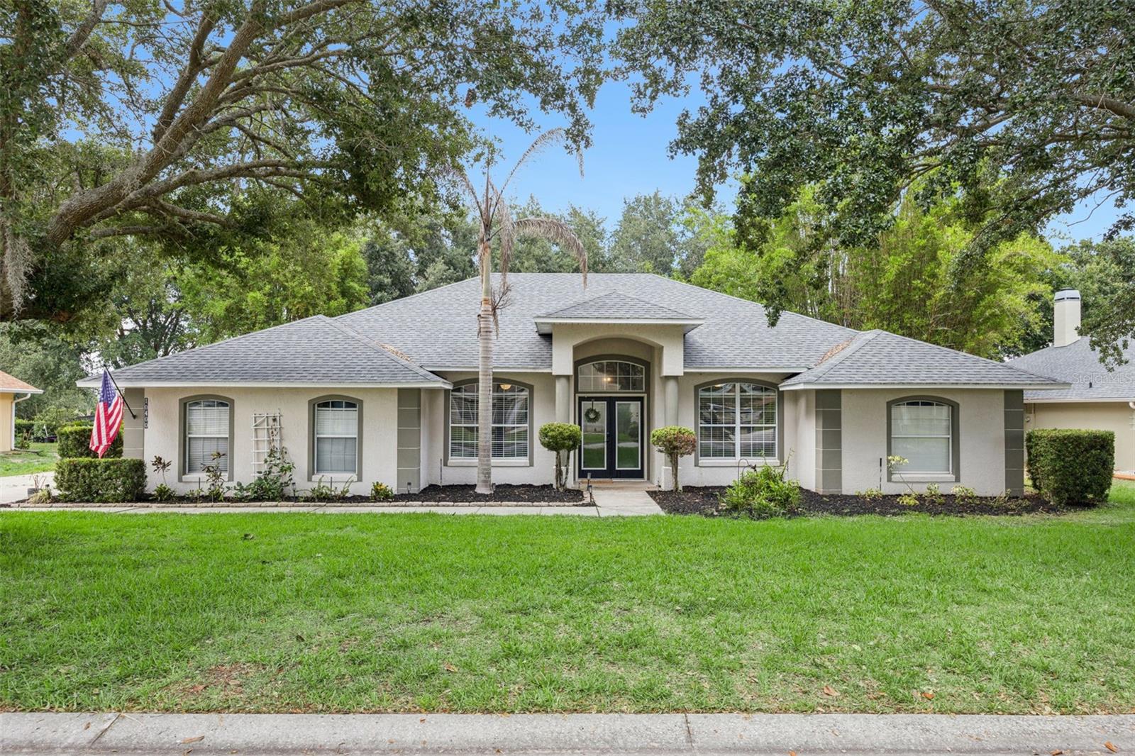 Enjoy the perfect blend of comfort, style, and outdoor living in this beautifully maintained 3 bedroom, 2 bath pool home situated on an oversized fenced lot in the highly desirable neighborhood of Crescent Lake Club. This home is the perfect blend of indoor style and outdoor living. The heart of the home is the remodeled kitchen, featuring a stunning warm island, industrial style lighting fixtures, new appliances, and plenty of space for gathering with family and friends. The living room features 14ft high ceilings lined with stunning wood beams and a cozy electric fireplace for you to unwind and spend time in your beautiful home. A split floorplan with an additional den and office maximizes your living space while still providing privacy. The home features stunning tile and laminate flooring throughout with no carpet anywhere. Step outside to your private backyard retreat, complete with a sparkling pool, screened enclosure, and room to relax, entertain, or play. The roof was replaced in 2022 adding additional peace of mind for it's next owner. Located in a sought after community of Lake Crescent Club, homeowners enjoy private lake access with a neighborhood boat ramp and dock to lake Crescent Lake offering direct access to the renowned Clermont Chain of Lakes, making it easy to spend weekends boating, fishing, and exploring beautiful Clermont. Conveniently located near Downtown Clermont with shopping, dining and excellent schools this home offers the lifestyle you've been looking for. Just over 30 minutes from Disney & Universal, Downtown Orlando and Orlando International airport you have the connivence of everything you could need in Central Florida. Summer is here, you could be sitting by the pool or cruising the Clermont chain of lakes as soon as you move in!