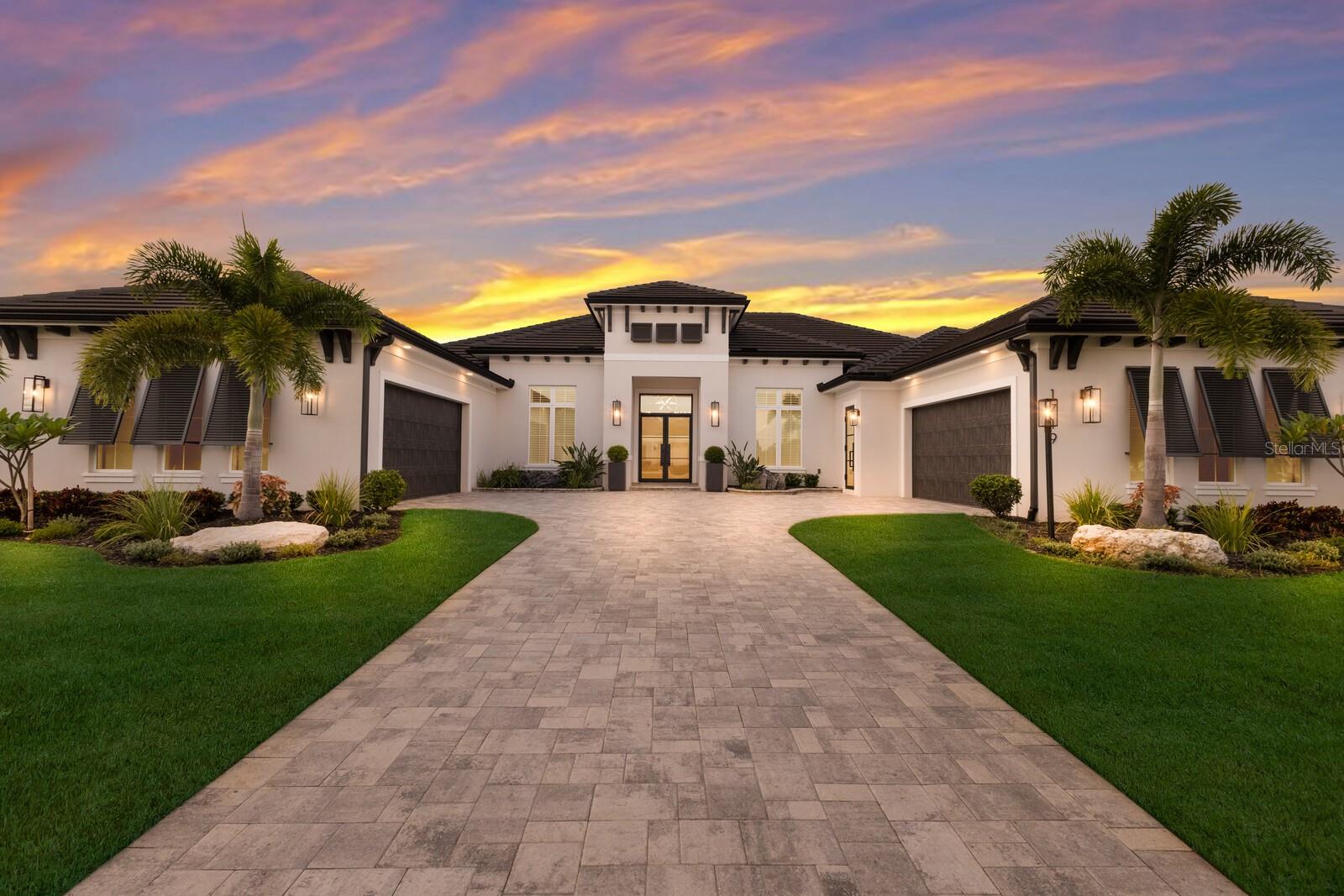 Discover the ultimate waterfront lifestyle in this extraordinary estate located within the private, gated The Islands on the Manatee River Enclave of Rio Vista Estates. With your boat just steps from your backyard, enjoy direct access to the Manatee River and Gulf of Mexico—only three miles away—making every day a boating day. Designed for both elegance and ease of living, this custom home captures sweeping water views from nearly every room. The open floorplan highlights soaring ceilings, crown molding, 8’ solid-core doors, and refined millwork. A culinary showpiece, the chef’s kitchen offers Miele appliances, 6 burner gas stove with grill, built in wall oven, dual dishwashers, pot filler, waterfall countertops, custom cabinetry, prep kitchen, and built-in bar. The grand living room features a fireplace and expansive 10' impact pocket sliding doors, creating seamless indoor-outdoor living. The private primary wing offers a retreat-like experience with water-view windows, Tray Ceiling, crown molding, dual closets—including a custom oversized walk-in with built-ins and automatic lighting—and a spa-worthy bathtub with jetted air, dual vanities, and a multi-head luxury steam shower with body sprays and rain shower head. Each guest suite is complete with its own en-suite bath, complemented by a large office/den with custom built in cabinets, bonus room, and guest powder bath. Outdoors, enjoy a heated saltwater volleyball-style pool, spa, gas fireplace, expansive lanai with panoramic view, and Heston-equipped summer kitchen. For boating enthusiasts, the dedicated storage with ice maker, fish-cleaning station, lighted paver deck, and 20,000-lb lift ensure every detail of your waterfront lifestyle is effortless. A four-car garage with air-conditioned storage adds practicality to the home’s thoughtful design. This exceptional residence combines refined luxury with direct boating access, delivering an unparalleled lifestyle in one of the region’s most desirable communities.  The Islands on the Manatee River Community is located on approximately 225 acres, and includes Gated 24-hour manned entry, River Lodge/River House - a centrally located gathering facility with riverfront views, Fitness center/Gym with views of the river, Fire Pits, outdoor seating, and grilling areas, Walking Trails, and a community docking facility.  Separate Membership access (optional)
to River Wilderness Golf & Country Club which includes:  18-hole championship golf course, tennis and pickleball courts, Bocce ball courts, Newly added Bar and Grill, elegant dining, banquet and clubhouse facility.