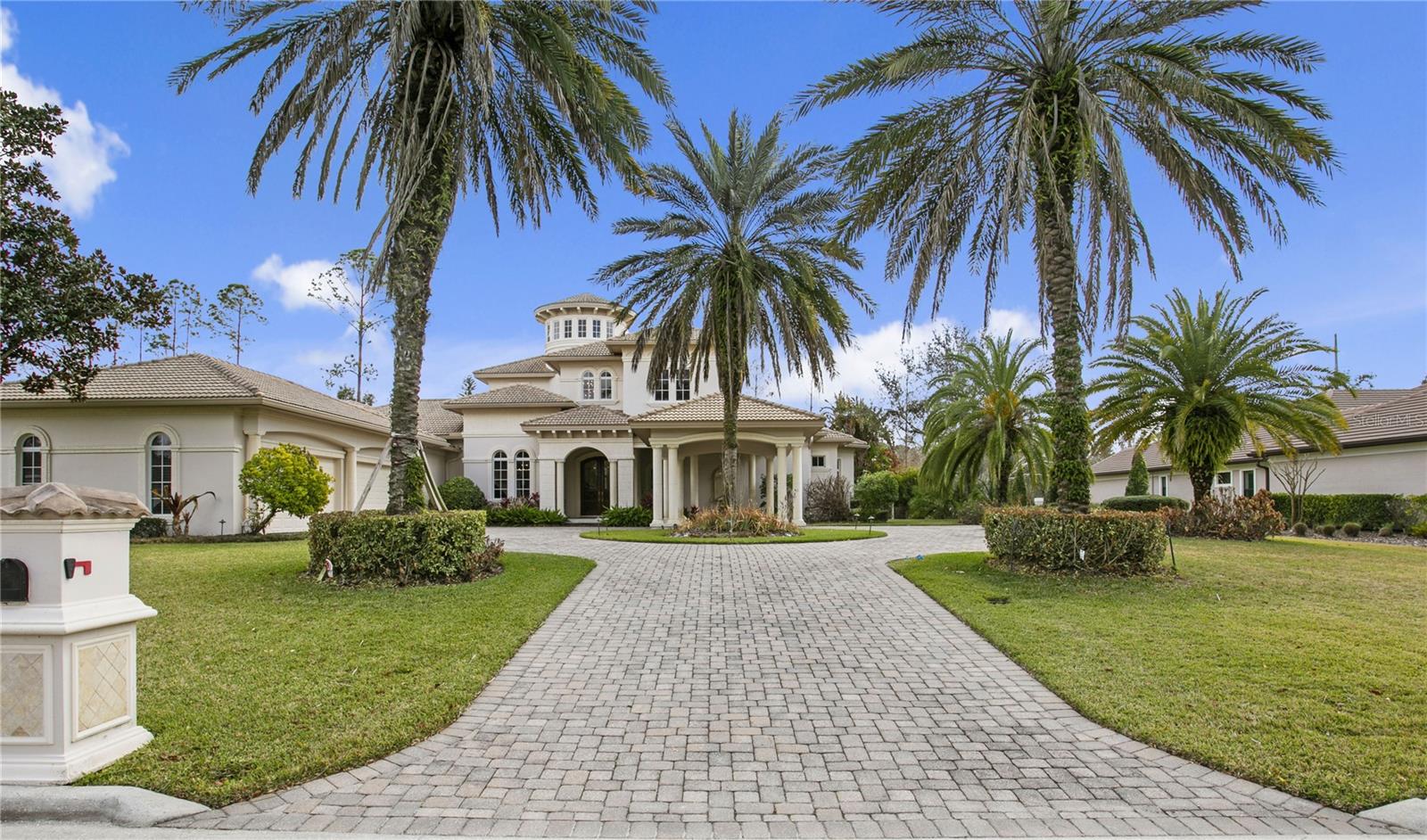 Welcome to your dream home in Avila, Tampa Bay’s premier guard gated golf and country club community! Experience superb architectural integrity and meticulous attention to detail throughout this custom-built executive residence. Built by Alvarez Homes in 2009, this stunning two-story Mediterranean masterpiece is perfectly situated on a private cul-de-sac lot in the tranquil area of Comunidad de Avila. From the moment you arrive, the elegant porte-cochère sets an impressive tone, leading you into a breathtaking 35-foot grand foyer graced by a sweeping mahogany wood, marble, and iron staircase.
The open floor plan is designed for the Florida lifestyle, with most rooms boasting views of the tropical infinity-edge heated pool and spa, an outdoor fireplace, a summer kitchen, and a lush, private backdrop—perfect for entertaining or relaxing in your own oasis. With over 5,790 square feet of luxurious living space, this five-bedroom, five full, and two half-bath home offers everything you desire.
On the main level, enjoy a formal living room, an elegant dining room, a gourmet kitchen that opens to the spacious family room, and an opulent office with custom mahogany built-ins, rich wood flooring, and a cozy fireplace. The gorgeous master retreat features dual expansive walk-in closets, a spa-like bath with private water closets, a soaking tub, a steam shower, and top-tier fixtures for the ultimate relaxation.
The gourmet kitchen is a chef's delight, equipped with two Sub-Zero refrigerators, double ovens, dual sinks in the island, a professional-grade gas cooktop, built-in microwave, Miele coffee center, ice-maker, and an oversized island that’s ideal for entertaining and buffets. Upstairs, three generous en-suite bedrooms, two with balconies, showcase walk-in closets, beautiful mahogany flooring, and an additional laundry room, offering comfort and privacy for family and guests alike.
This exceptional home comes loaded with amenities including, hidden safe room, elaborate crown moldings and trim, a massive four-car garage, an Generac generator, surround sound throughout, security system, a fenced backyard, a paver driveway, and the elegant porte-cochère. Every detail has been thoughtfully designed to provide a refined yet comfortable living experience—don’t miss your opportunity to own this remarkable Avila estate