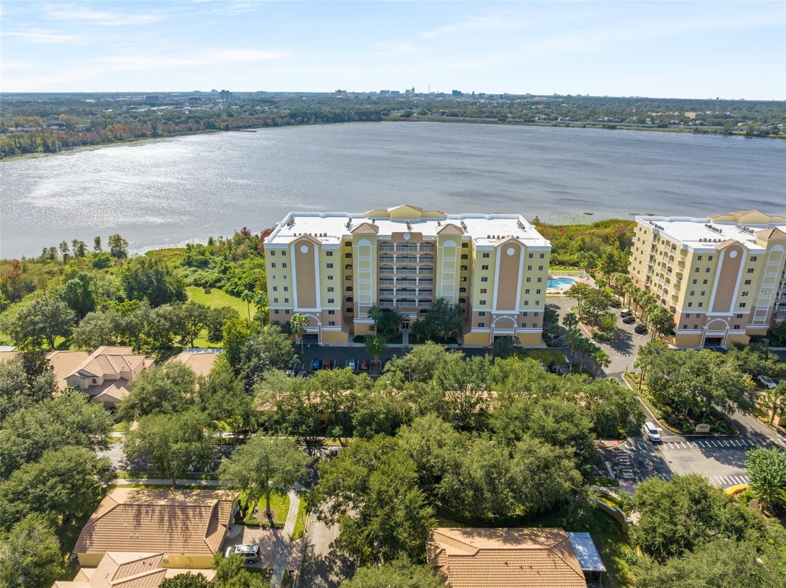 Available Now. The Promenade on Turkey Lake is one of Southwest Orlando's best kept secrets. This privately gated enclave is tucked away, yet centrally located near everything; with towering Oak and Spanish Moss trees that welcome you home on a picturesque drive in. Enjoy captivating lake views from this 3 bedroom, 2 bathroom, 7th floor condo. Freshly painted and updated, featuring beautiful tile and wood floors. The spacious living room is flooded with natural light and opens up to large balcony. The primary bedroom also features balcony access and has 2 large walk-in closets and an oversized bathroom with walk-in shower and soaking tub. Numerous other upgrades include new kitchen cabinets, new HVAC, water heater and light fixtures. The community offers fishing pier, pool and gym for it's residents. Enjoy nightly fireworks from Universal Studios and Disney, along with gorgeous sunsets and sunrises over the lake. Make your appointment today!