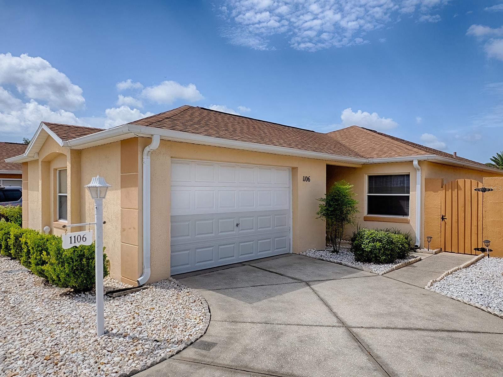 Imagine waking up each morning in the heart of The Villages, where every day feels like a vacation and the possibilities are endless. Whether you're enjoying an early round of golf, meeting friends for lunch, attending one of the countless clubs and activities, or taking a leisurely golf cart ride to live entertainment, this well maintained villa offers the lifestyle you've been searching for. Ideally located just outside the vibrant Spanish Springs Town Square, you'll find yourself only a moment away from nightly live music, restaurants, boutique shopping, seasonal festivals, and the energetic atmosphere that has made The Villages one of the nation's premier active adult communities.

Beyond the gates, convenience continues with easy access to the U.S. Highway 441 corridor, where you'll find medical offices, The Villages Regional Hospital, grocery stores, retail shopping, restaurants, and everyday essentials just minutes from home. Surrounded by championship and executive golf courses, scenic walking paths, recreation centers, swimming pools, pickleball and tennis courts, fitness facilities, and hundreds of organized clubs. 

Within a quiet, charming neighborhood, this attractive stucco villa welcomes you with a covered front entry and inviting curb appeal. You'll appreciate the peace of mind that comes with a newer roof installed in 2020 and an HVAC system replaced in 2022. Even better, this property offers no bond payment and no maintenance assessment, providing significant savings on your annual tax bill and making ownership even more affordable.

Inside you'll immediately notice the warm, inviting atmosphere. A convenient coat closet is tucked just behind the front door, while luxury vinyl plank flooring flows throughout the main living areas, creating a seamless blend of style and durability. Natural light fills the home, enhancing the comfortable living and dining spaces that are perfect for everyday living or entertaining guests.

The thoughtfully designed kitchen features stainless steel appliances, ample cabinetry, generous counter space, and an easy flow into the living area, allowing you to stay connected with family and friends while preparing meals. Whether hosting holiday gatherings or enjoying a quiet evening at home, this layout is designed for comfort and convenience.

Both bedrooms are generously sized and feature cozy carpeting, creating peaceful retreats at the end of the day. The primary suite offers privacy and comfort, while the guest bedroom and second full bathroom provide welcoming accommodations for visiting family and friends.

One of the home's most enjoyable features is the enclosed lanai with attractive tile flooring. This versatile space is perfect for savoring your morning coffee, reading a favorite book, working on hobbies, or simply enjoying Florida's beautiful weather year-round from the comfort of your home. Just outside, the low-maintenance courtyard provides an ideal setting for relaxing, container gardening, or entertaining without the upkeep of a large yard.

Whether you're searching for your forever home, a seasonal escape from colder climates, or an investment opportunity in one of Florida's most desirable 55+ communities, this villa checks all the boxes. With its unbeatable location near Spanish Springs, thoughtful updates, low-maintenance living, and access to the unmatched amenities this home is a must see. Schedule an appointment today!