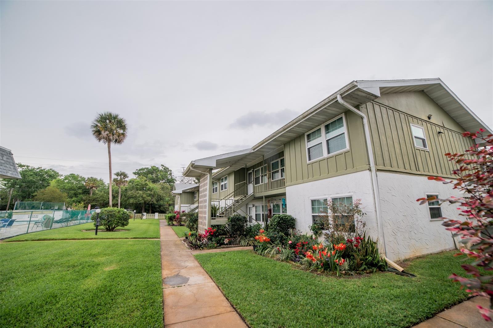 Just your personal items are needed to move into this FURNISHED condo. This is the location to be in....Just a short drive to the Worlds Most Famous Beach (<3 mi), the Daytona International Speedway, and outlet shopping. Enjoy a peaceful stroll through a local park, take a dip in the beautifully maintained swimming pool steps from your front door. Tennis courts and onsite laundry are steps away from this upper floor, unit. Low association fee (water included), assigned parking and on site, clean laundry area. Tastefully decorated down to the fully stocked kitchen. Hot water heater replaced Feb 2022. Furnished or unfurnished. This is the perfect vacation, 2nd home, or first time home buyer opportunity. All information is intended to be accurate but is not guaranteed. ;Water: City
