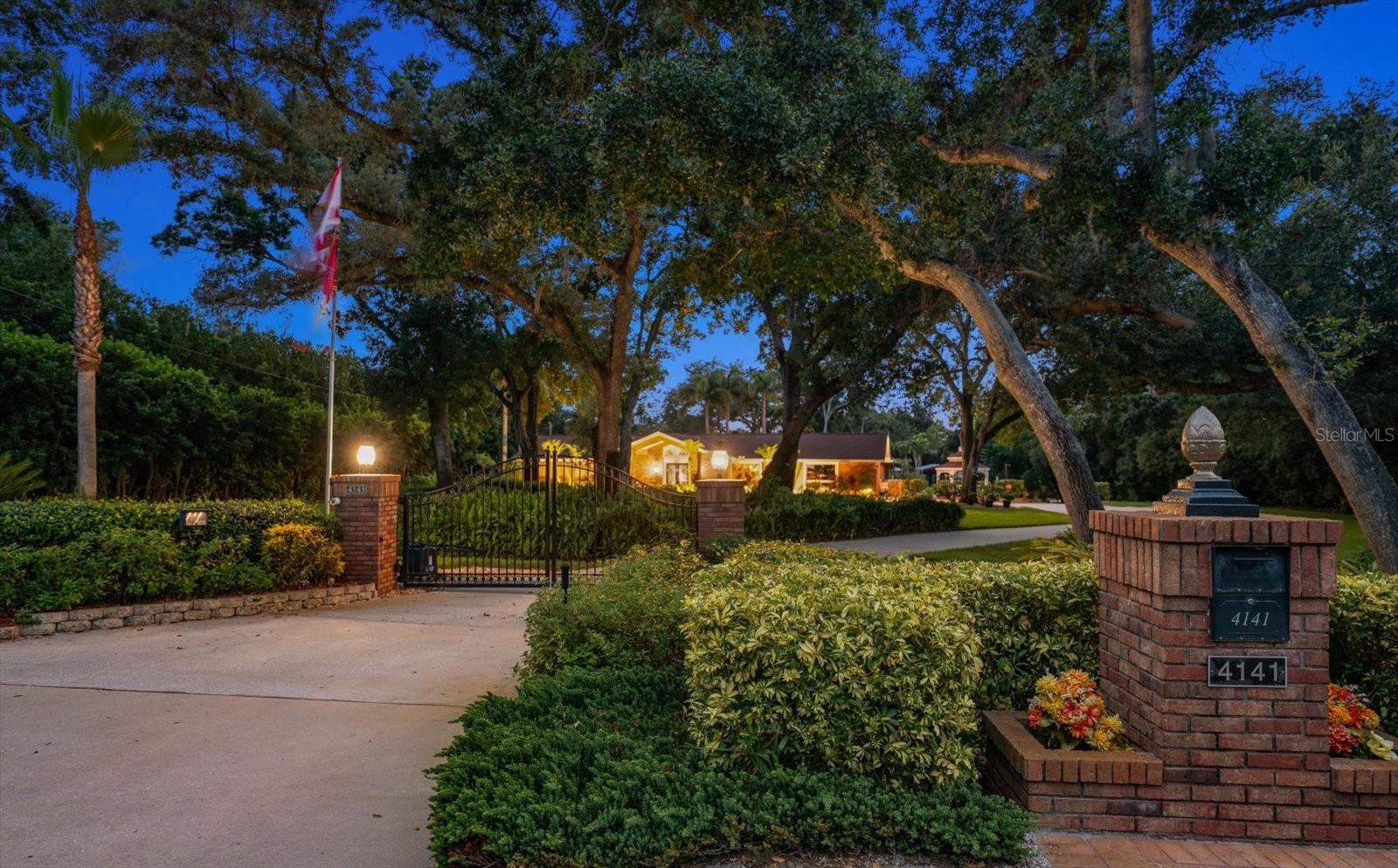 Rare opportunity to own a stunning 1.65-acre Residential Agricultural estate in unincorporated Palm Harbor in a premier location. Country living in the middle of Palm Harbor...agricultural status allows animal lovers to bring their horses and livestock!
Enter through a gated wrought-iron entrance to a fully fenced and beautifully landscaped property designed for both relaxation and entertaining. 
Outdoor living is exceptional with a sparkling saltwater pool featuring a waterfall and an expansive outdoor grilling station equipped with a premium Lynx grill . The peaceful backyard setting offers privacy and plenty of room to enjoy Florida living at its finest. The grounds feature two storage sheds, a pole barn, fire pit, and a dedicated RV pad complete with water, electricity, and a dump station.

Inside, this spacious home showcases a desirable split-bedroom floor plan with 3 bedrooms, 3 full bathrooms, a bonus room, and an enormous game room with volume ceilings. The game room features a custom-built bar with beverage coolers and overlooks the tranquil backyard, making it the perfect gathering space.
The luxurious primary suite includes an ensuite bath with double granite vanities, a stone walk-in shower, a jetted spa tub, and a separate sitting room overlooking the pool area. Quality finishes throughout the home include solid wood cabinetry, granite countertops, luxury vinyl plank flooring, and wood flooring.
Additional upgrades and features include a full irrigation system supplied by well water, two newer HVAC systems (5-ton and 3-ton units), and a whole-home tankless on-demand water heater. Located in a non-flood zone with no evacuation requirements, this exceptional property offers peace of mind, privacy, and endless possibilities—all in a highly sought-after Palm Harbor location.