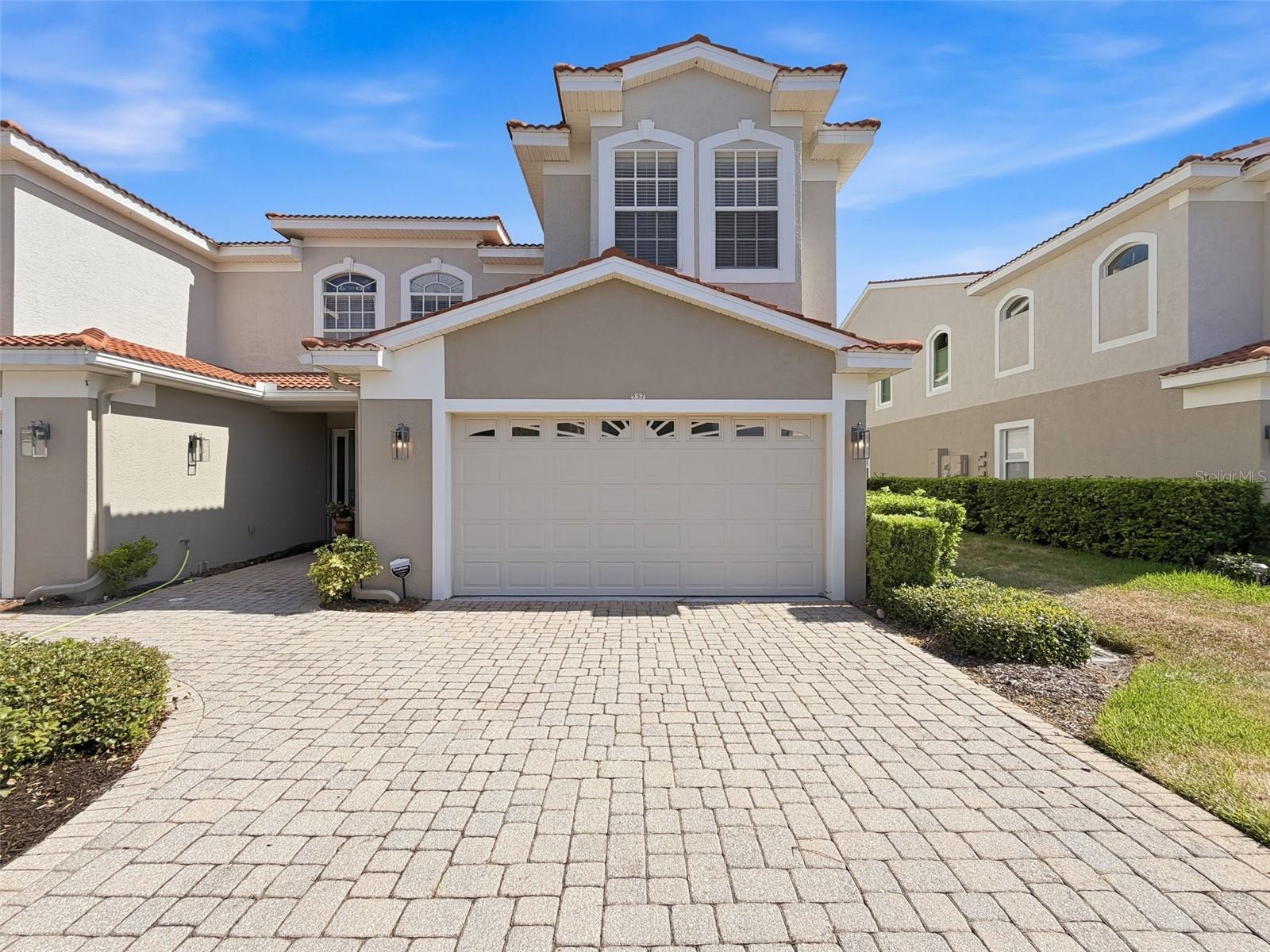 THIS IS ONE OF THE MOST DESIRABLE FLOOR PLANS IN THE MEDITERRANEAN-STYLE VILLAS OF SAN MARINO. As the community's largest model, offering 2,538 square feet, this end-unit residence provides an open, spacious feel with abundant natural light and enhanced privacy thanks to its premium end-of-row location.
The main living area features tile flooring and is filled with natural light from eastern and southern exposures. The kitchen is well-appointed with granite countertops, stainless steel appliances, a center island, and a generous closet pantry. An open staircase leads to the second level, where the upper hallway showcases an attractive open railing design rather than the more common closed drywall construction. All bedrooms are comfortably finished with carpeting, and the conveniently located second-floor laundry room is situated near every bedroom. The primary suite is exceptionally spacious, offering ample room for a reading nook, home office, exercise area, or additional seating. Step outside to the private balcony, which easily accommodates outdoor furniture and provides a peaceful retreat.
Its position within the community is another standout advantage. Facing a wider street, this end unit enjoys a more open setting and avoids the confined feel often found in interior sections. The front entry does not directly face a neighboring doorway, creating a greater sense of privacy. Outdoor living is equally impressive, featuring a spacious screened and tiled rear patio overlooking preservation and greenspace. Positioned to capture morning sun and afternoon shade, this serene setting offers both privacy and a beautiful natural backdrop.
Additional recent improvements include a new garage door and garage door operating system. The home is also equipped with a SimpliSafe security system for added peace of mind. For buyers seeking a move-in-ready opportunity, select furnishings are available and may convey with the sale, making the transition into this exceptional home even more convenient.
Residents enjoy access to a heated community pool, while the Pinellas Trail is located just outside the gates. The association is financially strong, with healthy reserves and proactive planning. Monthly fees cover exterior maintenance, roof replacement, landscaping, cable, internet, and trash service. Exterior painting was completed in 2023. Located in Flood Zone X500 with no flooding history and zoned for highly regarded Palm Harbor University High School, Palm Harbor Middle School, and Ozona Elementary School, this exceptional townhome combines one of the community's most sought-after floor plans with privacy and a level of openness rarely found within Villas of San Marino.