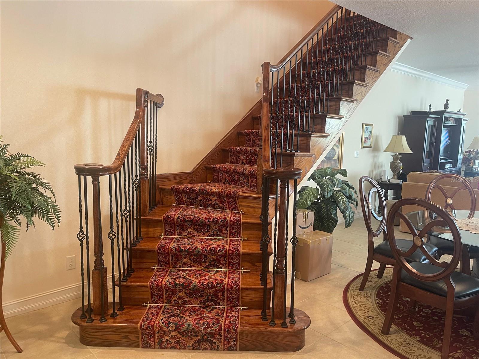 THIS IS ONE OF THE MOST DESIRABLE FLOOR PLANS IN THE MEDITERRANEAN-STYLE VILLAS OF SAN MARINO. As the community's largest model, offering 2,538 square feet, this end-unit residence provides an open, spacious feel with abundant natural light and enhanced privacy thanks to its premium end-of-row location.
The main living area features tile flooring and is filled with natural light from eastern and southern exposures. The kitchen is well-appointed with granite countertops, stainless steel appliances, a center island, and a generous closet pantry. An open staircase leads to the second level, where the upper hallway showcases an attractive open railing design rather than the more common closed drywall construction. All bedrooms are comfortably finished with carpeting, and the conveniently located second-floor laundry room is situated near every bedroom. The primary suite is exceptionally spacious, offering ample room for a reading nook, home office, exercise area, or additional seating. Step outside to the private balcony, which easily accommodates outdoor furniture and provides a peaceful retreat.
Its position within the community is another standout advantage. Facing a wider street, this end unit enjoys a more open setting and avoids the confined feel often found in interior sections. The front entry does not directly face a neighboring doorway, creating a greater sense of privacy. Outdoor living is equally impressive, featuring a spacious screened and tiled rear patio overlooking preservation and greenspace. Positioned to capture morning sun and afternoon shade, this serene setting offers both privacy and a beautiful natural backdrop.
Additional recent improvements include a new garage door and garage door operating system. The home is also equipped with a SimpliSafe security system for added peace of mind. For buyers seeking a move-in-ready opportunity, select furnishings are available and may convey with the sale, making the transition into this exceptional home even more convenient.
Residents enjoy access to a heated community pool, while the Pinellas Trail is located just outside the gates. The association is financially strong, with healthy reserves and proactive planning. Monthly fees cover exterior maintenance, roof replacement, landscaping, cable, internet, and trash service. Exterior painting was completed in 2023. Located in Flood Zone X500 with no flooding history and zoned for highly regarded Palm Harbor University High School, Palm Harbor Middle School, and Ozona Elementary School, this exceptional townhome combines one of the community's most sought-after floor plans with privacy and a level of openness rarely found within Villas of San Marino.