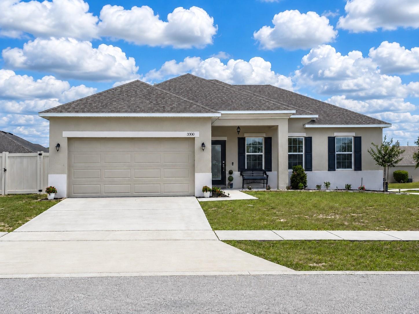 Welcome to this gorgeous 2016 Maronda Homes Fairfield model located in the desirable Mabel Loop Ridge community of Dundee! HOA only $35.42/month. Situated on a corner lot with a covered front porch that provides relaxing shade and charming curb appeal, this move-in-ready home offers beautiful upgrades, flexible living space, and a thoughtfully designed open floor plan. The Fairfield model is known for its functional layout, spacious living areas, and desirable split-bedroom design perfect for everyday living and entertaining.

Step inside to tall ceilings, crown molding, large ceramic tile throughout the main living areas, and a bright open-concept layout that feels both spacious and inviting. The showstopping gourmet kitchen features granite countertops, a pantry, and all appliances included, making it ideal for cooking, hosting, and gathering with family and friends.

The spacious primary suite is a true retreat featuring a beautiful ensuite bath with dual granite vanity sinks, an extra-large tiled walk-in shower, and a generous walk-in closet. Two additional bedrooms offer great space and comfort, while the flex room with elegant glass doors provides the perfect office, den, playroom, or guest space. The designated indoor laundry room includes the washer and dryer for added convenience.

Enjoy Florida living year-round on the extra-large covered and screened lanai overlooking the vinyl-fenced backyard. The owner also installed a large storage shed for extra storage space. The 2-car garage currently features attractive wood plank flooring and can easily continue to function as a garage or potentially be transformed into additional living or Florida room-style space. Furniture may also be negotiable, making this home an even easier move for the next owner.

Located near beautiful Lake Marie Park, Dundee offers peaceful small-town charm while still being conveniently close to everything Central Florida has to offer. Residents enjoy easy access to Winter Haven, Lake Wales, LEGOLAND Florida, Bok Tower Gardens, shopping, dining, and major highways leading to Orlando, Tampa, and Florida’s world-famous attractions and beaches. This beautiful Maronda Fairfield model combines comfort, style, flexibility, and location all in one exceptional home.