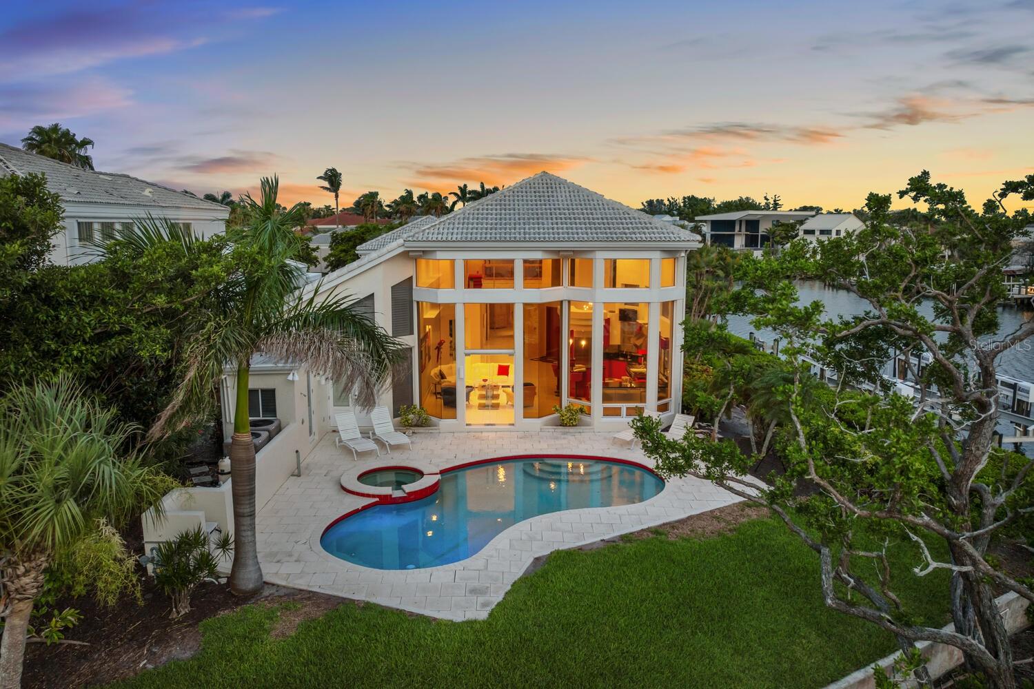 One or more photo(s) has been virtually staged. A boater’s dream location on Longboat Key in Queens Harbour….This is the “Best” waterfront lot in Queens Harbour! Deepwater canal and no bridges to the bay and intercoastal waterway from the exclusive neighborhood on Longboat Key in Queens Harbour.
 
125-lb boat lift on a deepwater canal for your Dream boat.
Location, Location, Location on Longboat Key with a Chef’s kitchen, contemporary interior design with three bedrooms, loft/ bonus room, 5 bathrooms, open pool deck with expansive views, and more… Also as an owner in Queens Harbor you have access to the private Bay Isles Beach Club on the Gulf of Mexico.