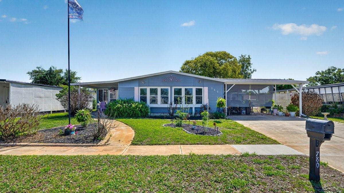 Discover a rare opportunity in Laurelwood Estates. A 55+ Community WITH NO LOT RENT. YOU OWN THE LAND, and it is a voluntary HOA. Featuring a 2021 roof and perfectly positioned at the end of a dead end street, this residence reveals an inviting, open layout just ten minutes from the coast and moments from the best of Port Orange shopping.

The interior is designed for both comfort and utility, featuring a formal dining room and two expansive living areas, one of which is accented by elegant built in cabinetry. Recessed lighting throughout enhances the bright, airy atmosphere, while storage is a recurring theme with two dedicated linen closets for easy organization.

The kitchen is a true standout for the culinary enthusiast, boasting a deep farmer's sink and a lighted walk in pantry. An abundance of cabinets surrounds the gourmet custom butcher block island, which is equipped with power on each end for added convenience.

The spacious primary suite serves as a comfortable sanctuary, featuring a jetted garden tub, a separate shower, and a versatile space that can function as either a double closet or a dedicated computer nook. The guest bathroom has been tastefully updated with a modern sink, a new toilet, and a stylish glass backsplash.

The exterior is anchored by a massive, fully equipped workshop featuring power, lighting, a sink, and a freezer. This outdoor oasis provides the perfect backdrop for the large, enclosed three season porch and sits within an oversized, fully fenced backyard shaded by mature trees and a variety of fruit trees. In addition to a security system, the property offers an oversized driveway and a three car carport, providing ample space for hosting game nights and visiting guests.

Schedule your showing today to come take a look!