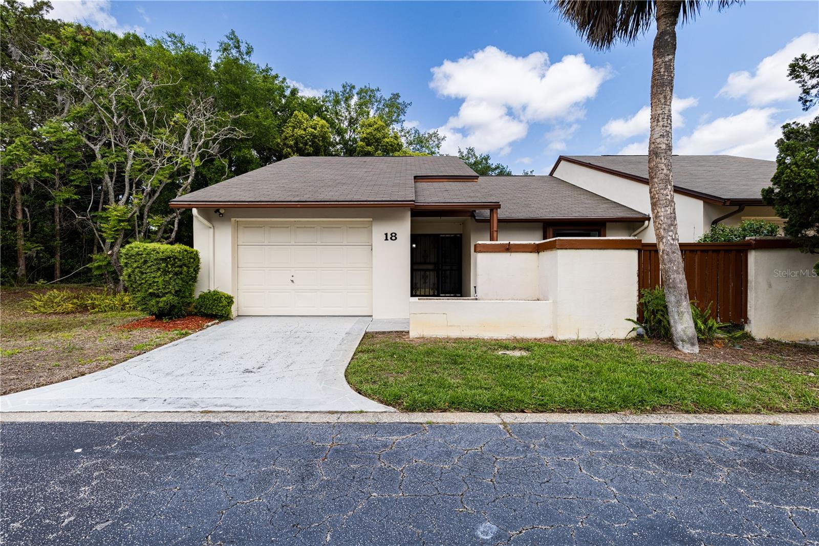 New Price ~ Move-In Ready End Unit in a Quiet Eustis Community! Welcome to 2681 Washington Ave, Unit #18. This home is a 2-bedroom, 2-bathroom end-unit home with an additional room that can be used as an office or storage. Located in a peaceful community of just 26 homes, this property is ideal for those seeking comfort, convenience and low maintenance living. Inside you’ll find fresh interior paint and new carpet in the two bedrooms, creating a bright and inviting feel. The spacious living area is centered around a cozy brick fireplace, adding warmth and character to the home with laminate flooring. The kitchen features brand-new appliances and flows easily into the main living areas, making everyday living and entertaining effortless. The Florida room offers additional space for entertaining, or you can use as a space for your hobby and relaxation... your choice. With a low HOA of just $150 per month and a convenient location close to shopping, dining, and major roadways, this home combines value, comfort, and location in one great package. Don’t miss your opportunity to own this affordable and centrally located home. Schedule your private showing today! All information recorded in the MLS is intended to be accurate however, it should be independently verified by buyer and their agent. Check out the Virtual Tour