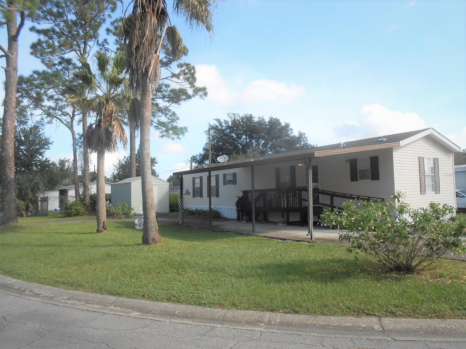 Owner says SELL.  There's NO better deal in town than this MOVE-IN READY, super CLEAN 2011 Manufactured Home. Circular driveway and Wheelchair Ramp invites you into this 2 Bedroom, 2 bath Beauty. Outside are TWO Utility Sheds With Power Supply. No Lot Rent, No HOA fee. Centrally Located to Shopping, Beaches and Airport. Home to NASCAR and Daytona Bike Weeks. ;Water: City