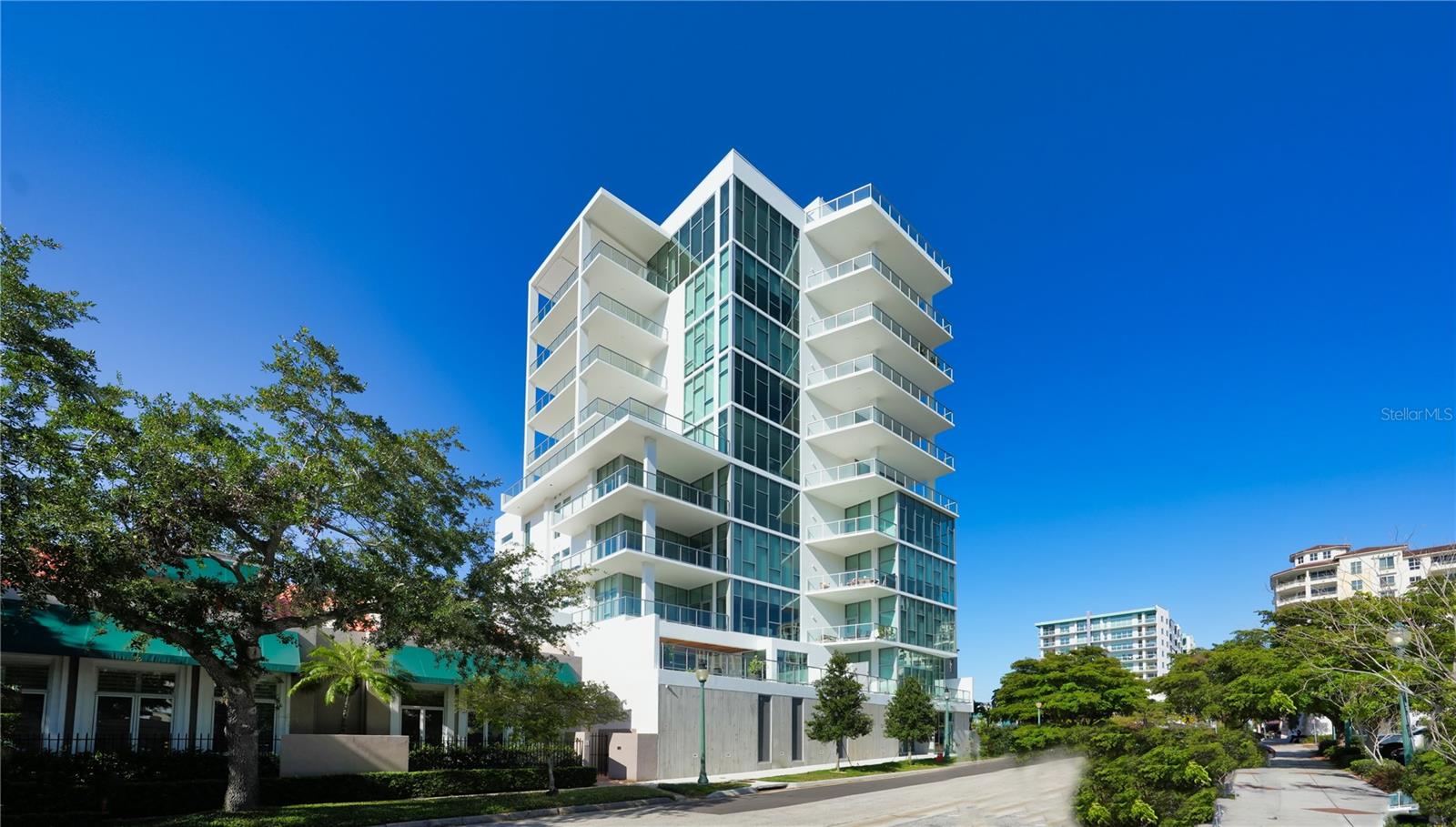 The Villa at THE Collection is one of the most unique new estates in the core of downtown. With over 800 SQF of private multiple terraces that create a single family home feel in the middle of the Downtown Core, this Villa is a true urban oasis. With expansive ceiling heights showcasing up to 13’ window walls of glass, natural light will flood the living/dining/kitchen open living area with huge views of the Sarasota Skyline. As day turns to dusk, enjoy gorgeous sunsets and twinkling city lights with the ideal South and West exposure to all of Sarasota. Featuring private access to an exclusive amenity level shared with only 11 neighbors, simply walk over directly from your Villa to the luxurious pool, spa, pool cabanas, fire table, grill, community room, board room, sauna, fitness center and private climate controlled storage - no luxury has been spared. The amenities truly feel like an extension of your private residence. The Villa features custom designed cabinetry, custom walk in closets, pantry and custom Library,quartz counter surfaces, floating vanities, tile throughout, a gas range and Miele appliances. The finest art collectors in the world all begin with one thing in mind – a passion for what they collect and the story of how they started. This is the same tale of The Collection Condominium - A building constructed to the highest level of luxury to emulate art and showcase the very best in lifestyle and design. It is the unique opportunity to translate a passion for Florida sunsets, the best in urban design, and a zest for an artful existence into a way of living. Welcome to the newest residential offering located in the heart of the art district in downtown Sarasota. THE Collection is a testament to boutique luxury, featuring only 12 residences in one of the quietest neighborhoods with a mid-century modern feel. Every residence at THE Collection exudes luxury estate living.