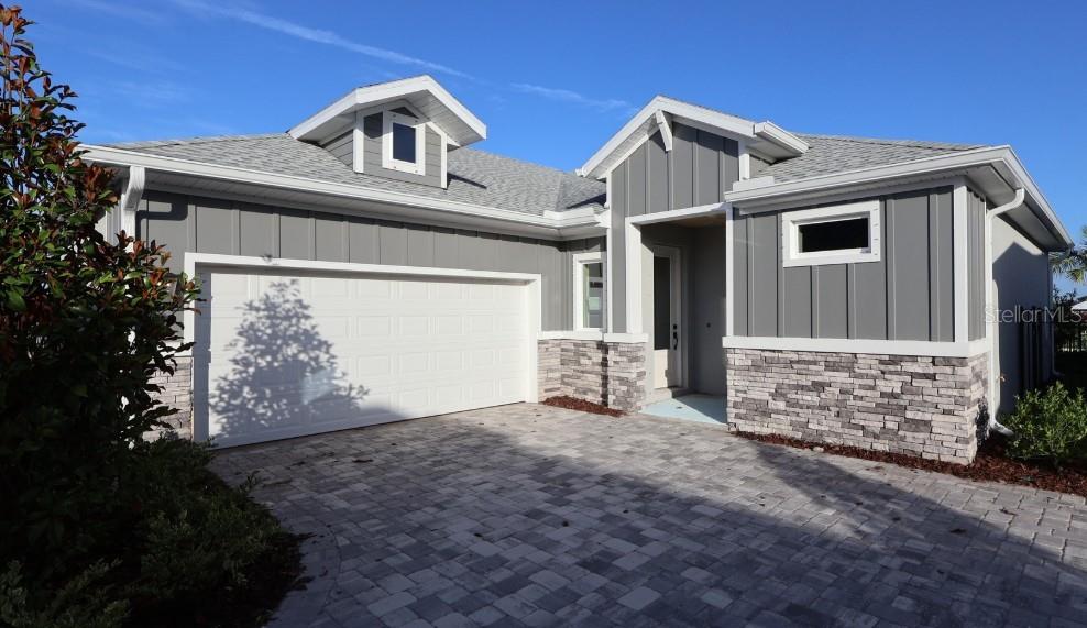 Under Construction. Live where coastal charm meets convenience—Apollo Beach with quick access to I-75, Tampa, and the airport. Located in the resort-style Waterset community featuring multiple clubhouses and fitness centers, 5 pools, 10+ parks, 12+ miles of trails, and courts for pickleball, tennis, sand volleyball, and basketball, all surrounded by lakes and green space. The Brolin bungalow offers stylish, easy single-story living with a designer kitchen at the heart of the home and an open flow to the dining and family rooms. White cabinetry with a sage green island, and laminate flooring create a clean, inviting look. The layout includes a private Owner's Retreat plus flexible secondary bedrooms—ideal for guests, a home office, or hobbies—along with an attached 2-car garage. Built by David Weekley Homes, this plan reflects LifeDesign planning for everyday comfort, energy-efficient construction, and an industry-leading 1-2-10 warranty for added peace of mind.