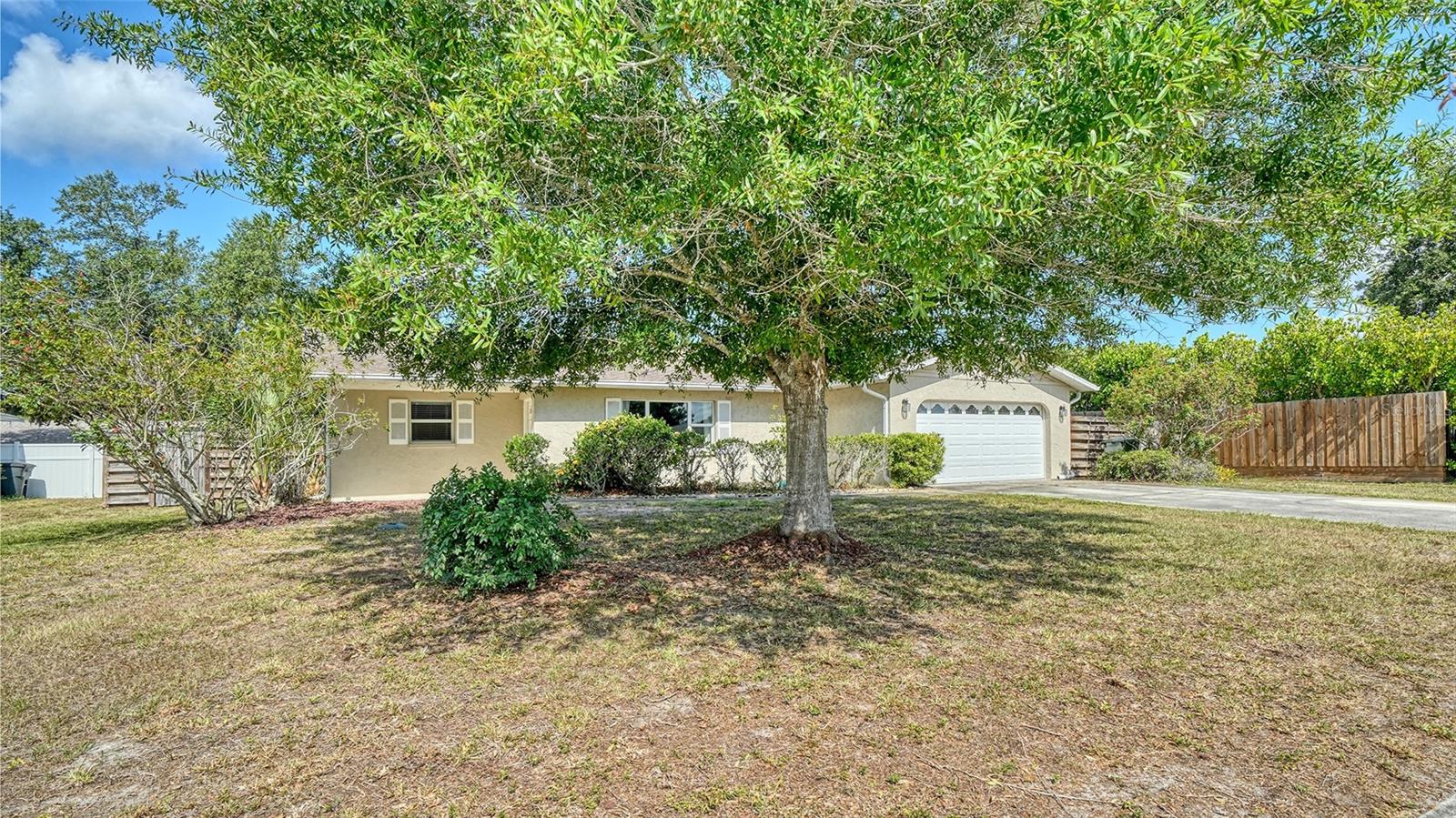Unlock the potential in this spacious 2,000+ square foot house, offering endless possibilities to create your dream home.  Whether you're looking for additional room for a growing family, a private guest retreat, or a multi-generational living arrangement, there's ample opportunity to add value by creating a fourth bedroom or an additional bathroom to form a second primary suite or mother-in-law suite.  Step through the front door into an expansive great room, where a wood-burning fireplace and tubular skylight create a warm and inviting gathering space. Open-concept kitchen and dining area with sliding doors to the generously sized screened lanai.  The primary suite has been thoughtfully modified for wheelchair accessibility, featuring a wider doorway and an open-access bathroom.  Important updates provide peace of mind, including a new A/C system (2021), hot water heater (2022), whole-house water filtration system, impact-resistant windows, and storm shutters for the sliding doors. The home is also wired for a generator and includes a propane tank for fuel.  Outside, the oversized two-car garage, utility shed, and fully fenced backyard offer exceptional storage and functionality. A wide gate provides easy access for boat, trailer, or recreational vehicle storage.  Located in the established community of Georgetowne, where residents enjoy low HOA fees and a peaceful neighborhood setting. Families will appreciate the convenient access to schools, parks, shopping, and dining, while seasonal residents will love the easy lock-and-leave features and proximity to everything that makes Sarasota special. Just minutes from the vibrant shopping, restaurants, and entertainment of University Town Center, the recreational opportunities at Nathan Benderson Park, Downtown Sarasota, and the area's renowned Gulf Coast beaches, this home offers the perfect blend of space, flexibility, and location.