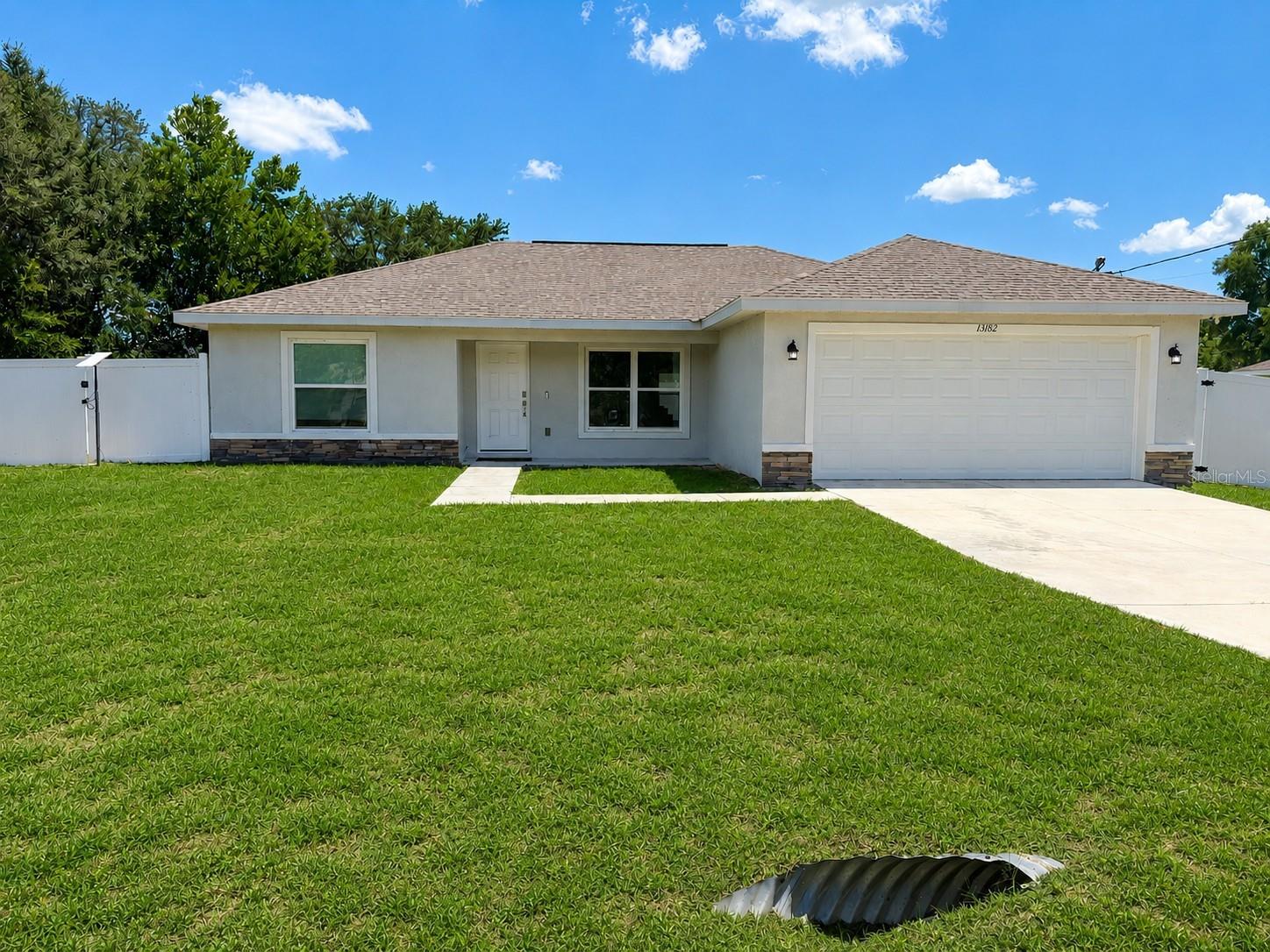 This energy-efficient home is conveniently located in the growing subdivision of Rolling Ranch Estates, just minutes from Hwy 484 and I-75 for an easy commute. Featuring an open floor plan with vaulted ceilings and luxury vinyl plank flooring throughout, this home offers both comfort and easy maintenance. Solar panels provide energy savings, while security cameras offer added peace of mind. The kitchen features white shaker cabinets, stainless steel appliances, granite countertops, and a center island with additional seating. Upgraded finishes, including recessed lighting and ceiling fans, add to the appeal of this highly desirable model. Situated on 0.23 acres, the property also includes a privately fenced backyard. Lawn maintenance is included with rent for added convenience. Pet restrictions apply. Easy to show!