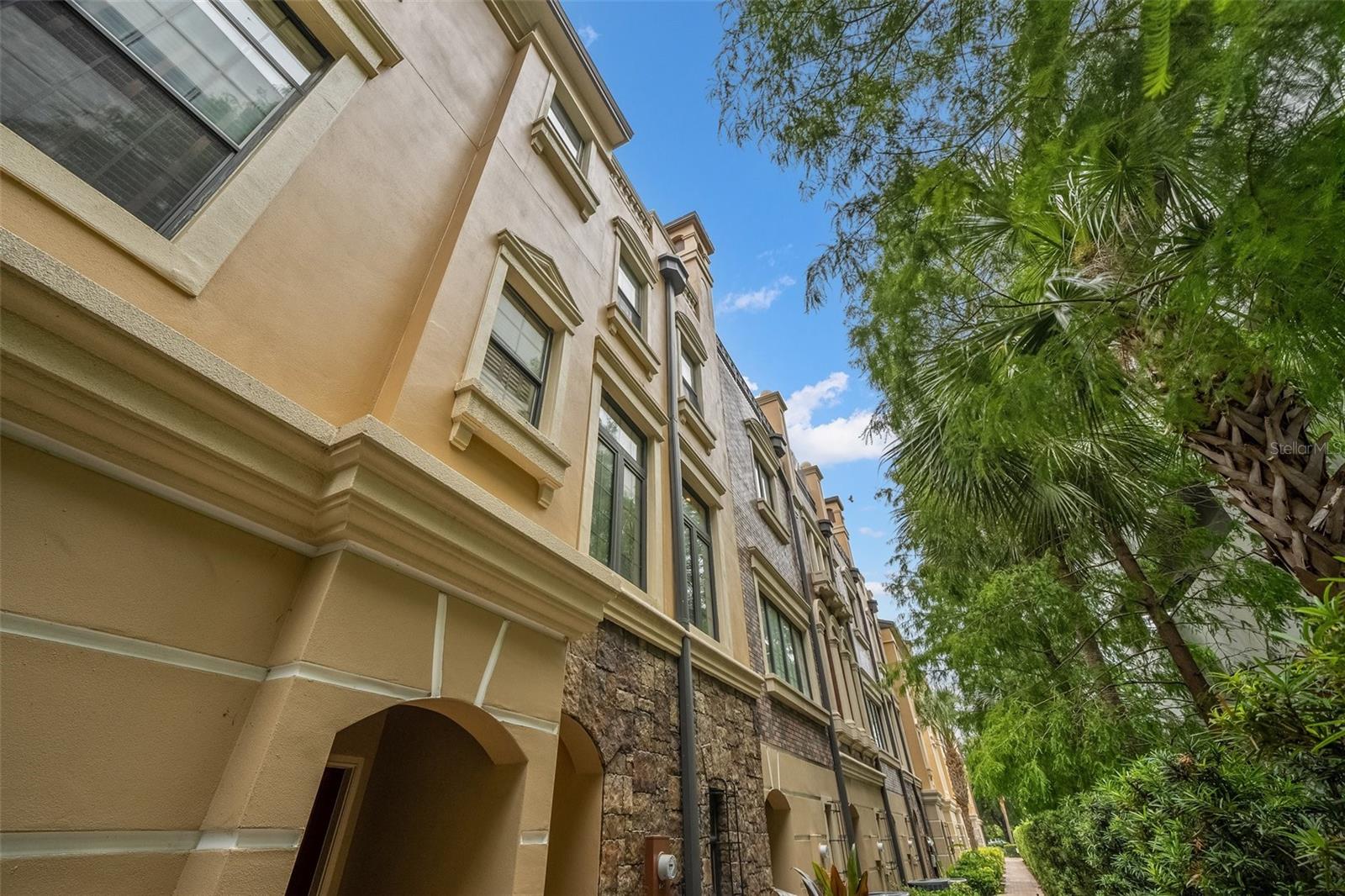 Welcome to the Pinnacle of South Tampa Luxury. A breathtaking portrait of urban elegance and design, this full-3 floor, 3-bedroom, 2.5-bathroom Townhouse offers cozy views and lavish city living in the heart of Tampa’s trendiest neighborhood. After traveling from the most amazing linear waterfront sequence along the Hillsborough Bay, BAYSHORE BLVD, down the legendary HOWARD AVE, Home to the SOHO Tampa Entertainment district, you will pull up to your tandem two-car private garage. Imagined by the superior Tampa architects, the home spans over 1600 sq. ft. Additional highlights include airy ceilings, luxury bamboo floors, Satori Calacatta tile, Smart temperature control, private outdoor-balcony, washer/dryer, and windows galore. This home has two staircases that have been upgraded with luxury bamboo flooring. The main staircase leads up to the second level and the second staircase  further leads to the third and upper primary suite level. 

The second level of this home begins with a sun-splashed eat-in kitchen adorned with a breakfast nook, polished stone counters, shaker cabinets, Satori Calacatta tile, recessed lighting and high-end stainless steel appliances. The kitchen spills into the living room and dining area which features luxury bamboo flooring, recessed lighting, custom elegant light fixture and windows that triple the exposure of natural light. Adjacent to the living room you will find the half bath equipped with Satori Calacatta tile and a elegant pedestal sink. 

The third level houses two guest bedrooms with large closets, windows for added natural light, ceiling fans and a designated full bathroom featuring a custom wood vanity, polished stone and a shower-tub combo for your guests luxury comfort. 

The primary suite sits on the upper northern side of the home and receives vibrant morning light with dual exposure which features two French doors that spills onto your private balcony which is perfect for al fresco dining. Also, you have direct access to your future walk-in closet/ reach-in closet and en-suite with Satori Calacatta tile, a custom wood double vanity with a polished stone countertop, and a walk-in shower featuring a signature waterfall shower-head. 

Brownstones of Soho are magnificent luxury Townhouses that are the biggest eye catching buildings in the area that feature state-of-the-art bespoke bricks that boast the elegance of these amazing buildings. Residents enjoy being within walking blocks from Berns Steak House which obtains one of the worlds largest wine selections and moments from bars, trendy cafes, shops, Green Lemon, Fresh kitchen and Hyde Park Village which is amazing for your evening walks. Pets are welcome.