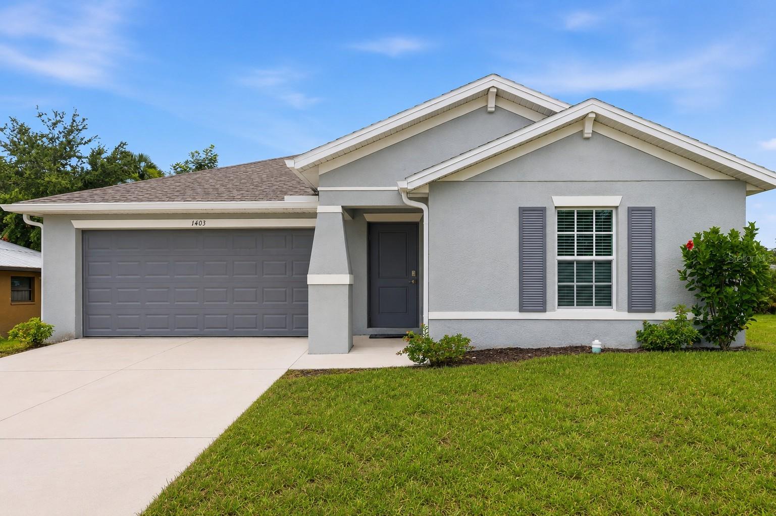 BETTER THAN NEW! 2024 LENNAR BUILT HOME WITH FULL IMPACT WINDOWS & DOORS, NEW CARPET, NEW CUSTOM INTERIOR PAINT | NO HOA | NO CDD| X FLOOD ZONE

Why wait to build when you can own a home that's already better than new? Welcome to 1403 Aken Street, an exceptional 3-bedroom, 2-bathroom residence that has been barely lived in and thoughtfully upgraded beyond typical builder standards. Move-in ready and priced to sell, this home offers the perfect blend of quality, style, and convenience.

From the moment you walk through the door, you'll appreciate the bright, open-concept design and upscale finishes throughout. The stunning kitchen is the heart of the home, showcasing beautiful quartz countertops, stainless steel appliances, modern cabinetry, and designer finishes that create a timeless, elegant space for everyday living and entertaining.

Unlike many new construction homes, this property has already been enhanced with premium interior paint, eliminating the standard builder-grade finishes, and features new upgraded carpet, giving the home a fresh, luxurious feel that's truly move-in ready. Built with hurricane impact windows, you'll enjoy added storm protection, energy efficiency, and peace of mind for years to come.

The spacious primary suite offers a relaxing retreat, while the additional bedrooms provide flexibility for family, guests, or a home office. Step outside to your private backyard, offering plenty of room to unwind, entertain, or create your own outdoor oasis.

Enjoy the freedom of no HOA, no CDD fees, city water, and the added benefit of being located in a preferred X Flood Zone, helping keep ownership costs low. The attached two-car garage provides ample storage, while the home's prime location offers quick access to Punta Gorda, I-75, area hospitals, shopping, dining, parks, and all that Southwest Florida has to offer.

Homes this new, this upgraded, and this competitively priced are hard to find. Skip the wait and hidden costs of new construction—1403 Aken Street is ready for you today. Schedule your private showing before this incredible opportunity is gone!