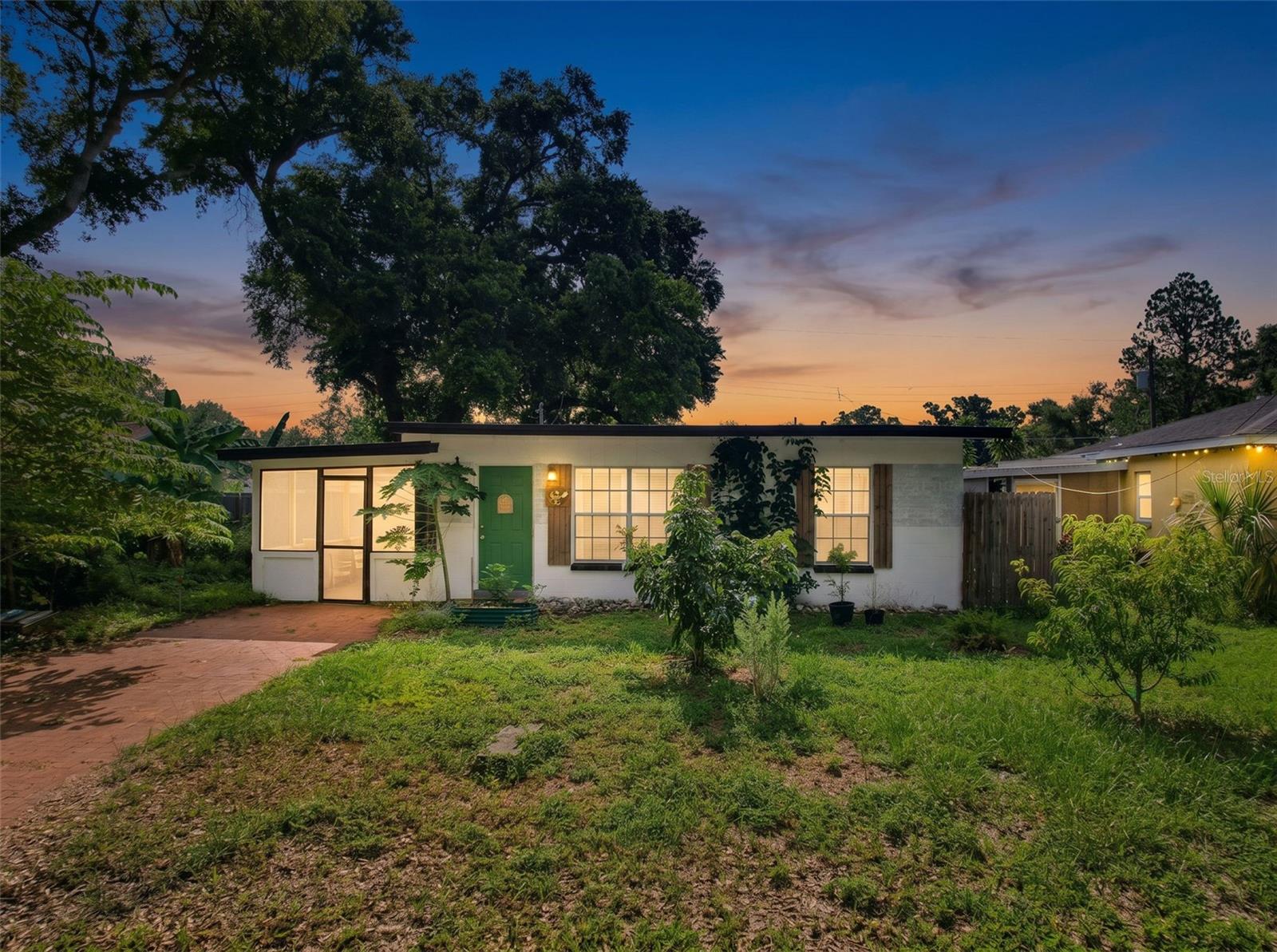 This small gem delivers a stunning shine. No HOA, no CDD, fully fenced, this parcel of land is yours to play with. Rear has fruit trees and lush vegetation and room to grow in order to lead the farm to table life. A newer kitchen with stone countertops, new cabinets and stainless steel appliances awaits inside, don't forget the window over the sink looking out to the backyard. Great to keep an eye on kids and pets because all are welcome here. Sit back and relax soaking up the Florida breeze on your screened in porch. Don't forget your kayak and fishing poles as you are near the Gulf of America.  Pack the golf clubs to tee off on the many public courses nearby.  The Pinellas Trail accesses miles of biking and walking paths. Snow Birds Welcome!
