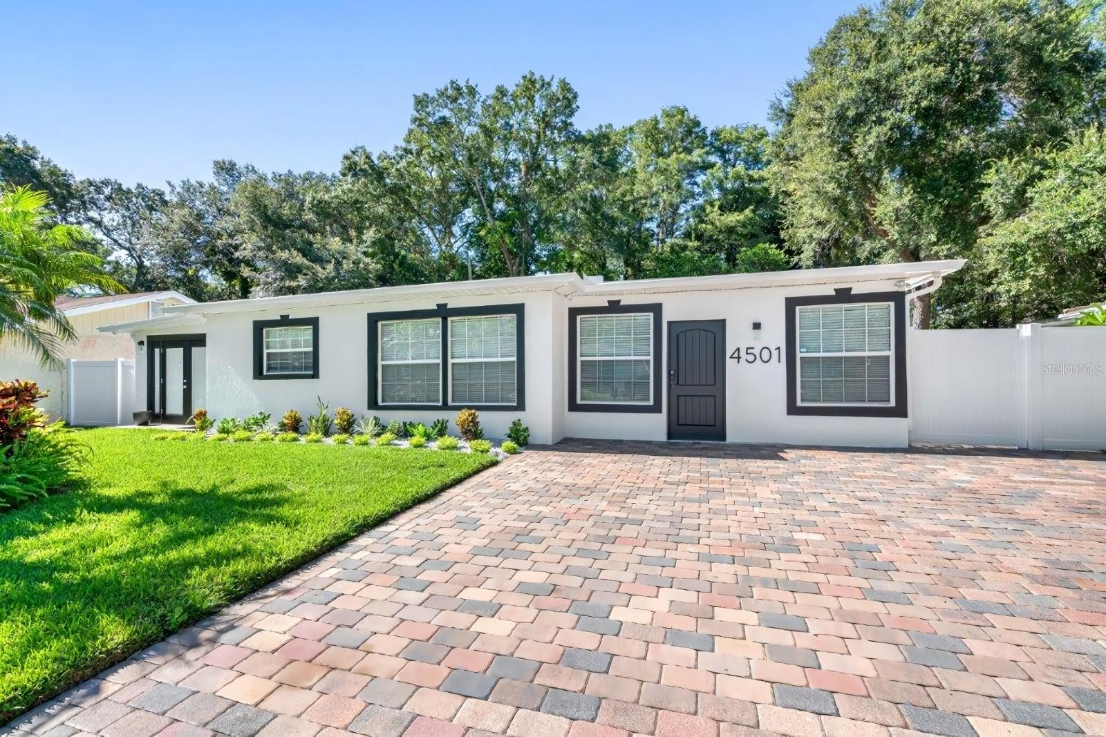 Welcome to a prime, income-generating opportunity in the heart of Tampa. This fully renovated, turnkey property comes completely furnished and is already producing immediate cash flow with active lease agreements in place—perfect for investors seeking a seamless, ready-to-go asset. Ideally situated just minutes from Raymond James Stadium, Hillsborough Community College, major hospitals, and the popular Armature Works, the location offers strong rental demand and convenient access to everything Tampa has to offer. The property totals 7 bedrooms and 5 full bathrooms, with the main house offering 4 well-appointed bedrooms and 2 full bathrooms, featuring modern upgrades throughout. Complementing the main residence are three private studio units, each with its own bathroom, ideal for maximizing rental income and tenant flexibility. The exterior is just as impressive, with attractive, low-maintenance landscaping and a spacious backyard patio complete with covered seating. This high-performing property is a standout opportunity for investors looking to secure a centrally located asset with strong returns from day one.