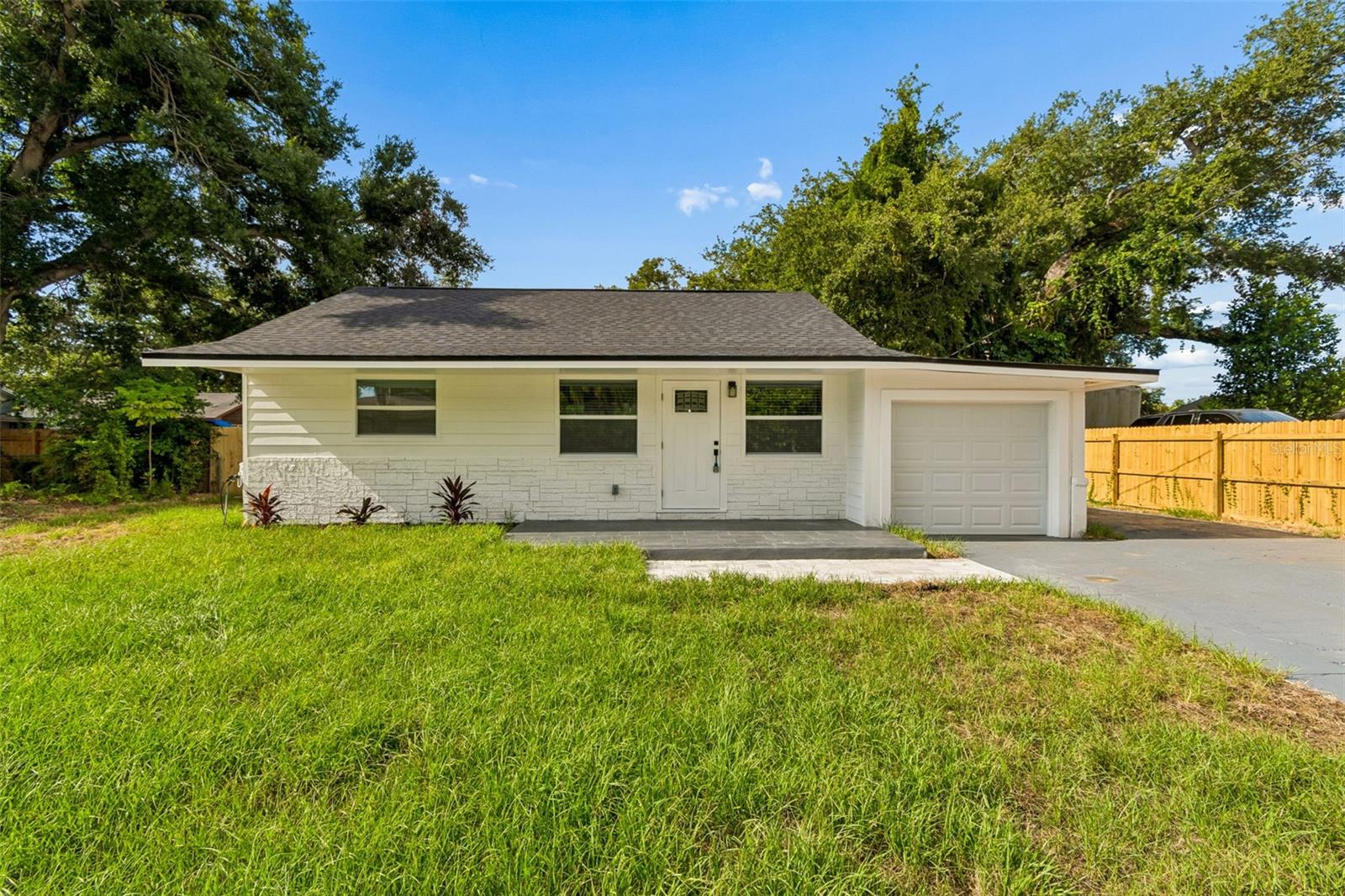 Beautifully renovated and move-in ready, this 3-bedroom, 2-bath home offers quality updates throughout with all major improvements completed under permit for added peace of mind. Recent renovations include a new roof, new electrical system, new energy-efficient windows, new flooring throughout, a completely remodeled kitchen, and two fully renovated bathrooms featuring modern finishes and fixtures. The functional floor plan provides comfortable living spaces with a bright, updated interior that is perfect for everyday living or entertaining. The spacious backyard offers plenty of room for outdoor activities, gardening, or future additions, and includes two solid concrete block storage sheds in excellent condition for extra storage or workshop space. Conveniently located in the heart of Bradenton, this pristine home is just minutes from shopping, dining, schools, parks, downtown Bradenton, Riverwalk, and the Gulf Coast beaches. Whether you're a first-time homebuyer, downsizing, or looking for an investment property, this home is ready for its new owner. Don't miss this opportunity to own a fully updated home where all the major improvements have already been completed.