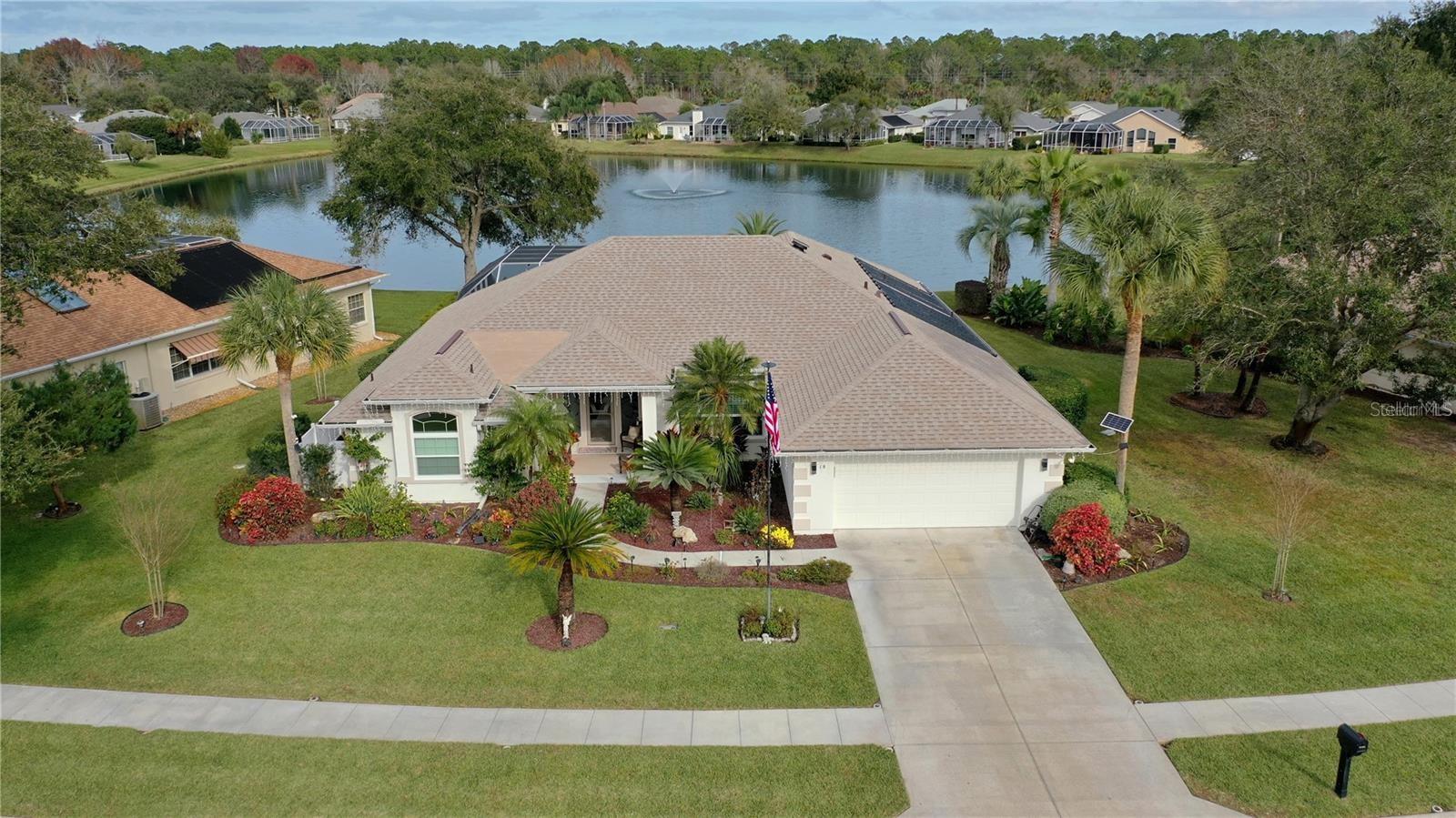 Prepare to be captivated as you step into this breathtaking upgraded custom built ICI Westminster model nestled in the charming community of "Arlington." Situated in the heart of Palm Coast, a scenic lake community hidden by hedges and beautiful landscaping. Also included is underground utilities, street lights and sidewalks. 10 minutes to shopping, churches, hospital. This residence truly embodies luxury living. As you enter you will be greeted by an awesome view of the custom pool with waterfall that overlooks the lake. The L/R welcomes you with a pool table, setting the stage for endless entertainment. The D/R offers space for hosting family gatherings. The custom kitchen offers 42"cabinets, pull out shelves, top of the line S/S appliances-GAS STOVE! Cozy evenings snuggle up in the F/R by the stone fireplace. Owners suite offers haven of relaxation. Unwind in soaking tub, Shower, ensuite bathroom w/dual closets and vanities. BR#2 has its own private bathroom. BR#3 shares guest bath with door that leads to 15x30 Screened patio. Tranquility offered by the
 10 x12 covered porch with 75"TV. This home includes porcelain tile thru out and carpet in the BR.s. NEWER ROOF, HVAC ,HW heater, GENERAC Generator, new gas heater for pool, newer fans. interior and exterior painting, New blinds and camera system.  Walk in and kick off your shoes and enjoy the beauty that surrounds you. 5 minutes to Pine Lakes Golf Course,10 minutes to Palm Coast community center offering pickleball and tennis courts, dog park. . 20 minutes to Flagler Beach and ICW for fishing and boating, kayaking, jet skiing. Historic St. Augustine is 30 minutes north, Daytona Beach NASCAR is 30 minutes South. Now step out back onto your enclosed Porch with giant 75" TV to enjoy those sports while relaxing in pool. This is a great entertainment home for family gatherings. Check out this beauty. Nothing to do in this house but party! Flagler Beach 20 minutes away. St. Augustine 30 minutes north,. Dayton 30 minutes south.  So make that appt today, It WONT last long! Pet friendly neighborhood!