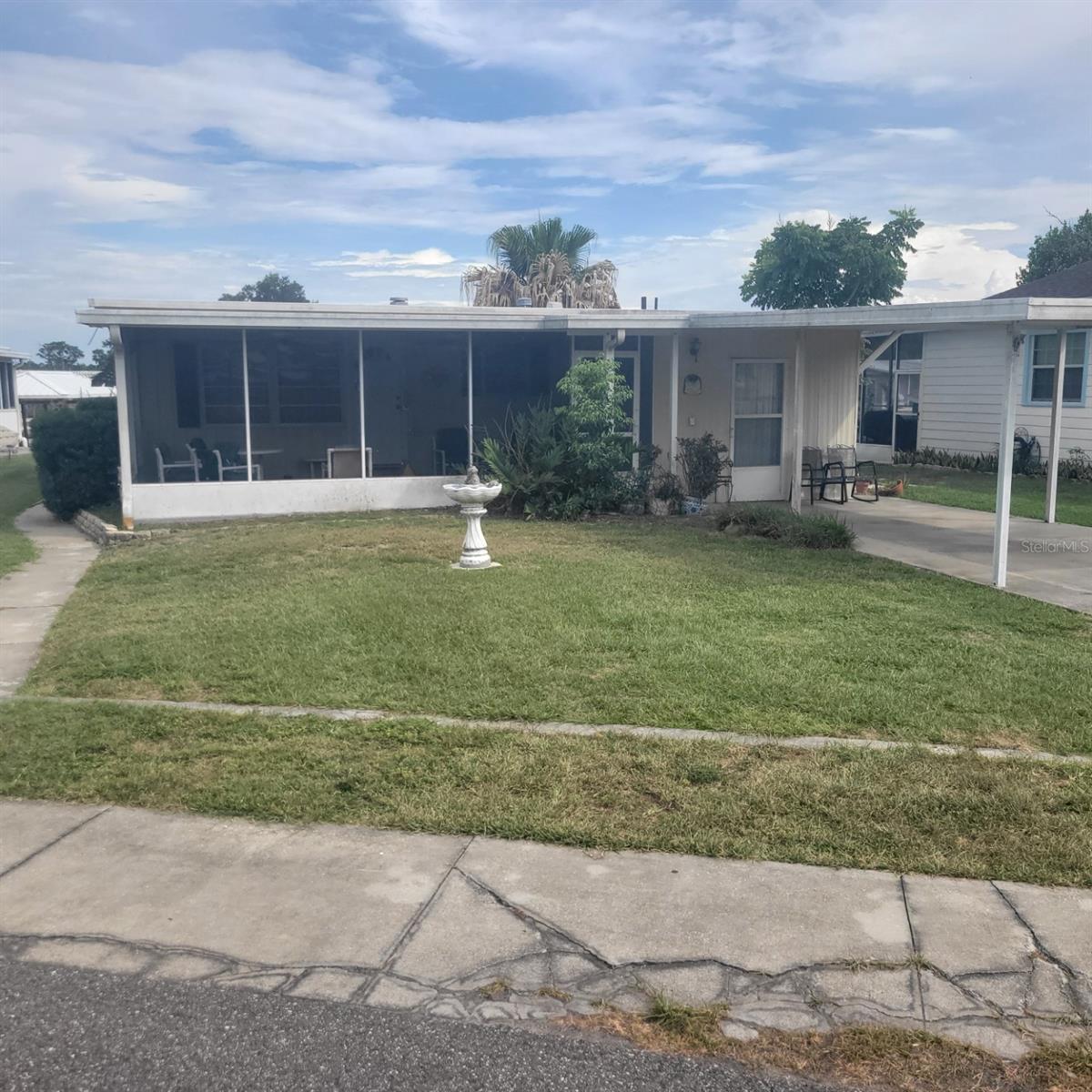 Ready to enjoy life on the water with your boat lifted in the boathouse in the backyard that is on the chain of lakes?  Here's your chance.  Here is your chance to relax and enjoy life.  This 2 bedroom 1 bath home is completed furnished and ready to move in.  The boat house is equipped with an boat lift, bock and sink.  The location is very close to a lot of stores and restaurants.