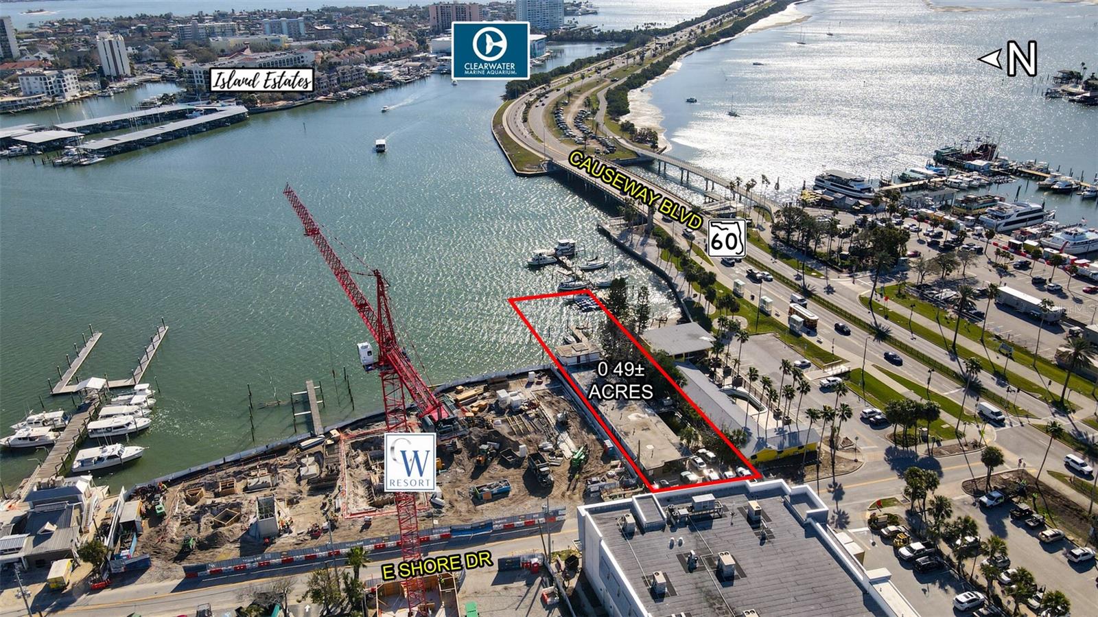 Premier Redevelopment opportunity in thriving Clearwater Beach.  This waterfront property is located on Mandalay Channel along the intracoastal waterway adjacent to the 91-key CW Hotel & Marina under construction.  Formerly operated as a quaint beach motel, it is just moments away from Clearwater's sandy beaches, bustling Beach Walk, a hub of dining, entertainment and shopping experiences and the nearby Clearwater Marine Aquarium.
The property is .49 acres (.27 Upland) with a "T" (tourism) Zoning and Future Land Use "RFH"  (Resort Facilities High), City of Clearwater.
PRICE IMPROVEMENT:  $2,990,000