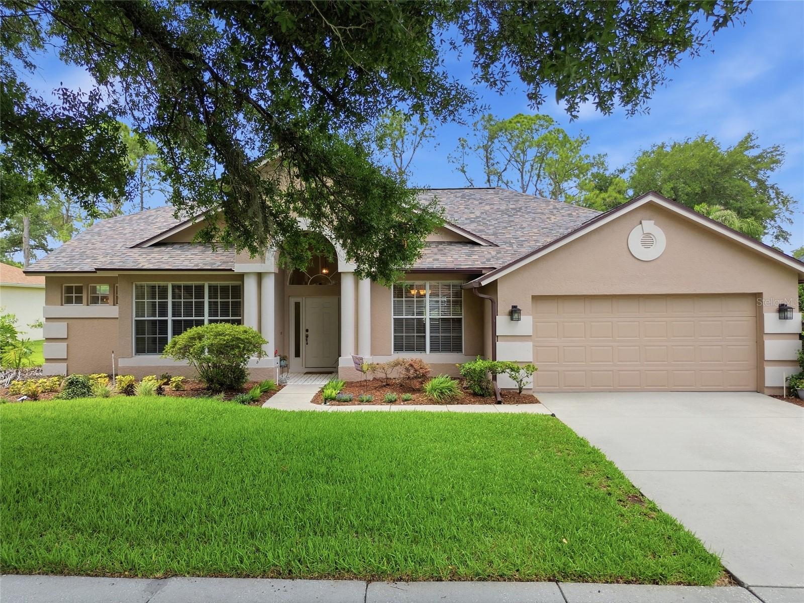 Welcome to River Hills Country Club! One of Hillsborough County's most sought-after private, guard-gated golf communities. Nestled along a rare, oversized lot with a sweeping view of the championship golf course (hole 3 to be exact), this 3-bedroom, 2-bathroom pool home offers a lifestyle that is simply hard to duplicate in River Hills. From the moment you arrive, the curb appeal sets the tone with its lush mature landscaping, a majestic oak canopy, and a brand new dimensional shingle roof (2025) welcome you home. Step inside through the arched entry foyer and you'll immediately appreciate the thoughtful layout. A dedicated office with built-in shelving sits just off the entry which is perfect for working from home with a view of the front yard, while a formal dining room anchors the opposite side. The open living room is the heart of the home, featuring built-in shelving and a wall of sliding glass doors that frame your private outdoor oasis and the emerald fairways beyond. The kitchen offers ample cabinet space, tile flooring, recessed lighting, and a pass-through view that keeps the cook connected to both the dining nook and the outdoors. The spacious primary suite features direct slider access to the pool and patio, a generous walk-in closet, and an en-suite bath with dual vanities, soaking tub, and separate step-in shower. Both secondary bedrooms are well-sized and share a full hall bath with its own entrance to the pool area. Step outside and the real story unfolds. A large covered, screened lanai opens to a beautifully resurfaced pool that is all set against a wide, private golf course backdrop that stretches as far as the eye can see. The unique lot configuration creates a backyard depth and openness that very few homes in River Hills can match. Whether you're starting your morning with coffee by the pool, hosting friends on the paver patio, or simply watching the sunset over the fairway, this outdoor space delivers every single day. Additional highlights include the pool resurfacing with pavers installed (2016), pavers sanded and double sealed (Jan 2026), dual stage AC (Aug 2025), water heater (Dec 2025), exterior paint (Jan 2020). Beyond your backyard, River Hills Country Club is currently in the midst of a dramatic renovation; what the club is calling its "return to glory" expected to be completed at the end of the year. Residents will enjoy access to the "Gentleman Joe" Lee Signature 18-hole championship course, newly resurfaced greens using the same surface found on 12 PGA Tour venues. Pinehurst No. 2, LED-lighted Har-Tru clay tennis courts, brand new pickleball courts, a Junior Olympic-sized swimming pool, a 24-hour fitness center, a beautifully appointed clubhouse with casual and upscale dining by an award-winning chef, basketball and volleyball courts, a playground, and over 4.2 miles of maintained hiking and walking trails along the Alafia River corridor. River Hills truly has something for everyone. Just outside the gate, River Hills Plaza puts everyday convenience within minutes: The Landing, The Brunchery, La Villa Mexican, fitness studios, and more. You're also close to top-rated schools, easy access to I-75, and a comfortable commute to downtown Tampa, MacDill AFB, and Florida's Gulf beaches. The bones are exceptional. The setting is one-of-a-kind. All that's left is your personal touch.