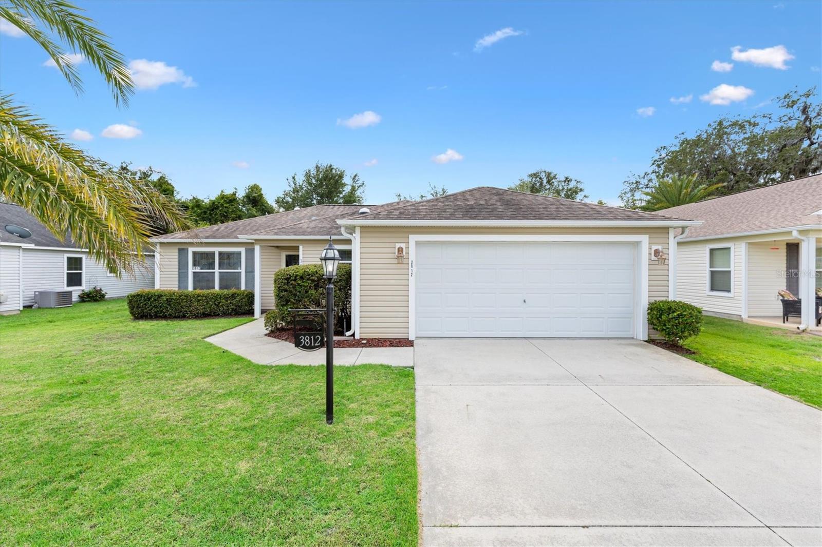 LOCATION!! CLOSE TO BROWNWOOD SQUARE! This 3/2 Sandpiper Model Home in the Village of Hillsborough features an open, split-bedroom floor plan with vaulted ceilings and a covered front porch. TURNKEY Optional! Just 2 miles to Brownwood town center for shopping, dining and entertainment. 1 mile to Eisenhower Regional recreation center for activities and ½ mile to Hillsborough pool and mailbox station.
Inside, you'll find luxury vinyl plank flooring throughout the main living areas, tile in the kitchen, and comfortable carpeting in the bedrooms. The living and dining rooms are enhanced with elegant chair rail detailing. Ceiling fans with light kits throughout the home.
The kitchen is designed for both function and style, featuring stainless steel appliances, pull-out cabinet shelves, a pantry cabinet, breakfast bar, decorative backsplash, and a solar tube that fills the space with natural light.
The spacious primary suite offers a walk-in closet and an ensuite bath complete with dual vanities and a walk-in shower. A pocket door separates the guest wing, providing privacy for family and visitors. The guest bath also features a walk-in shower. There is Solar tube in the guest wing hall.
Step outside to the screened lanai with attractive wood-look tile flooring and a ceiling fan, creating the perfect space to relax and enjoy Florida living. An adjacent outdoor patio provides an ideal spot for grilling and outdoor dining. Additional conveniences include an inside laundry room with a utility sink and 2 car garage.
Golf Cart being sold separately.
Situated on a homesite with no homes behind and room for a pool, this property offers added privacy and peaceful views. As an added bonus, the fire hydrant located on the property may provide an insurance discount for the new owner. This exceptional home combines comfort, functionality, and a desirable location—ready for you to enjoy all that The Villages lifestyle has to provide! Call today to schedule an appointment to see this home and start living The Villages dream.