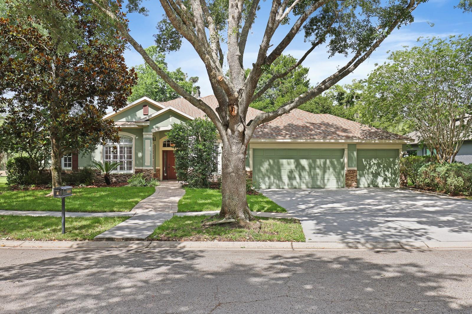 Welcome to the gated community of Kestrel Ridge in highly sought-after Fishhawk Ranch, where this beautifully maintained 4-bedroom, 4-bathroom home is tucked away on a quiet cul-de-sac lot with tranquil pond views and no backyard neighbors. Offering a spacious and versatile layout with a 3-car garage, formal living spaces, flexible work-from-home options, and an expansive bonus room, this home combines comfort, functionality, and thoughtful updates throughout.
Inside, a welcoming entry leads to the formal dining room accented by rich wood flooring, while a private den/office behind glass French doors provides the ideal setup for working from home, studying, or managing everyday tasks. The spacious living room serves as the heart of the home, featuring a cozy wood-burning fireplace framed by custom built-in shelving and large sliding doors that open to the extended screened lanai.
Designed with both entertaining and everyday living in mind, the kitchen offers an abundance of cabinetry and workspace complete with Corian countertops, tile backsplash, center island, pantry closet, built-in double ovens, cooktop, microwave (2021), dishwasher (2020), and refrigerator (2023). Recent updates include lighting fixtures, and a new sink and faucet installed in 2019.
The split bedroom floor plan provides privacy for everyone. The primary suite is privately situated and features an en-suite bathroom with dual sink vanities, garden tub, separate glass-enclosed shower, private water closet, and a walk-in closet accessed through the bathroom. Bedrooms two and three are positioned on the opposite side of the home and share a convenient Jack-and-Jill bathroom with a tub/shower combination. Bedroom four is tucked toward the rear of the home and separated from the secondary bedrooms by a thoughtfully designed flex space featuring built-in desks, shelving, and a window seat, making it ideal for homeschooling, homework, or an additional work-from-home area. A third full bathroom is conveniently located adjacent to bedroom four.
Upstairs, a massive bonus room and fourth full bathroom create endless possibilities for a media room, game room, guest retreat, fitness space, or additional living area. Throughout the home, ceramic tile enhances the wet areas, wood flooring adds warmth to the formal dining room and office, while carpet provides comfort in the living room, bedrooms, and bonus room. Louvered plantation shutters throughout the home add timeless character and style.
Step outside to enjoy peaceful pond views from the oversized screened lanai, which was extended and upgraded with pavers in 2021/2022. The above-ground hot tub/spa conveys with the home, creating the perfect place to relax at the end of the day. Additional exterior enhancements include a widened front walkway with upgraded pavers completed in 2020. The home also includes updated laundry room cabinetry with a utility sink, a water softener installed in 2021, updated sliding door blinds installed in 2024, and a roof replaced in 2022 for added peace of mind.
Adding even more charm and functionality to the backyard is a child’s playhouse/shed complete with locking doors and double-hung vinyl windows, which also conveys with the sale. Located in the amenity-rich Fishhawk Ranch community with access to pools, parks, playgrounds, fitness centers, trails, and top-rated schools, this home offers the perfect combination of space, privacy, and convenience.