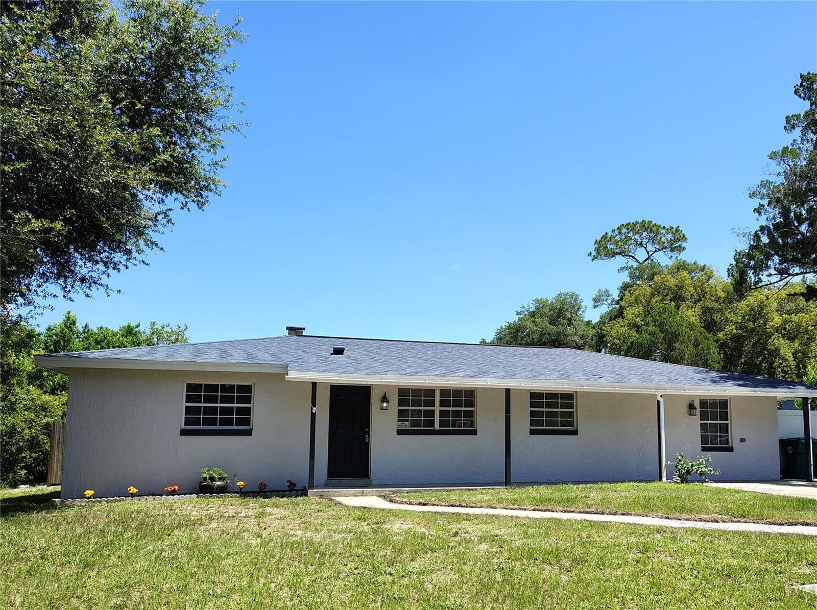 POOL HOME ~ NO HOA~MAJOR UPDATES COMPLETED WITHIN THE LAST FOUR YEARS. Florida living starts here! Enjoy the freedom of NO HOA and the comfort of this inviting 4-bedroom, 2-bath pool home offering approximately 1,800 square feet of comfortable living space in the heart of DeLand. The versatile floor plan offers flexible living spaces to fit today's lifestyle, while the private backyard and inground pool provide the perfect setting for relaxing, entertaining, or simply enjoying Florida's year-round sunshine. Major updates completed within the last four years include the roof, A/C, water heater, new sliding glass doors, wood siding, stucco, new waterproof flooring, tile, pool resurfacing and equipment and more! Providing added confidence in some of the home's most important components. Additional improvements throughout the home offer an excellent opportunity to move in and personalize the space to reflect your own style. Conveniently located just minutes from historic Downtown DeLand, Stetson University, shopping, dining, medical facilities, short distance to parks, schools, and with easy access to I-4. This home offers convenient access to Orlando, Daytona Beach, and everything Central Florida has to offer. Whether you're looking for a primary residence, seasonal getaway, or investment opportunity, this property combines location, flexibility, and value in one exceptional package. Come see why this property offers so much more than just another house—it offers the opportunity to enjoy everything that makes Florida living so special. Schedule your private showing today!