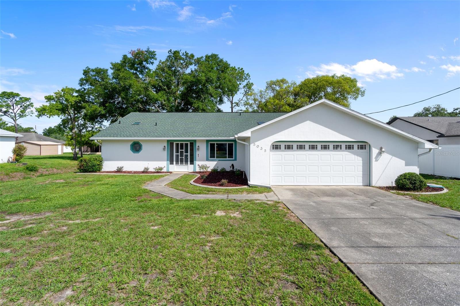 Welcome to this beautifully updated 3-bedroom, 2-bath home situated on a spacious 0.23-acre lot in a peaceful neighborhood. Offering 1,822 square feet of comfortable living space, this home blends style, function, and comfort—perfect for families, remote workers, or anyone looking to enjoy the Florida lifestyle. Step through the elegant double glass doors into an inviting living room featuring luxury vinyl plank flooring and an open, welcoming feel. The stunning kitchen is a true centerpiece, showcasing solid wood cabinetry, gorgeous quartz countertops, a built-in cooktop and oven, stainless steel appliances, and abundant storage—ideal for both everyday living and entertaining. A dedicated office/flex space adds versatility and can easily serve as a home office, hobby room, playroom, or guest space. The air-conditioned Florida room provides additional living space and a bright, relaxing area to enjoy year-round. With thoughtful updates throughout, spacious bedrooms, and a functional layout, this move-in-ready home offers the perfect combination of comfort, convenience, and modern appeal.