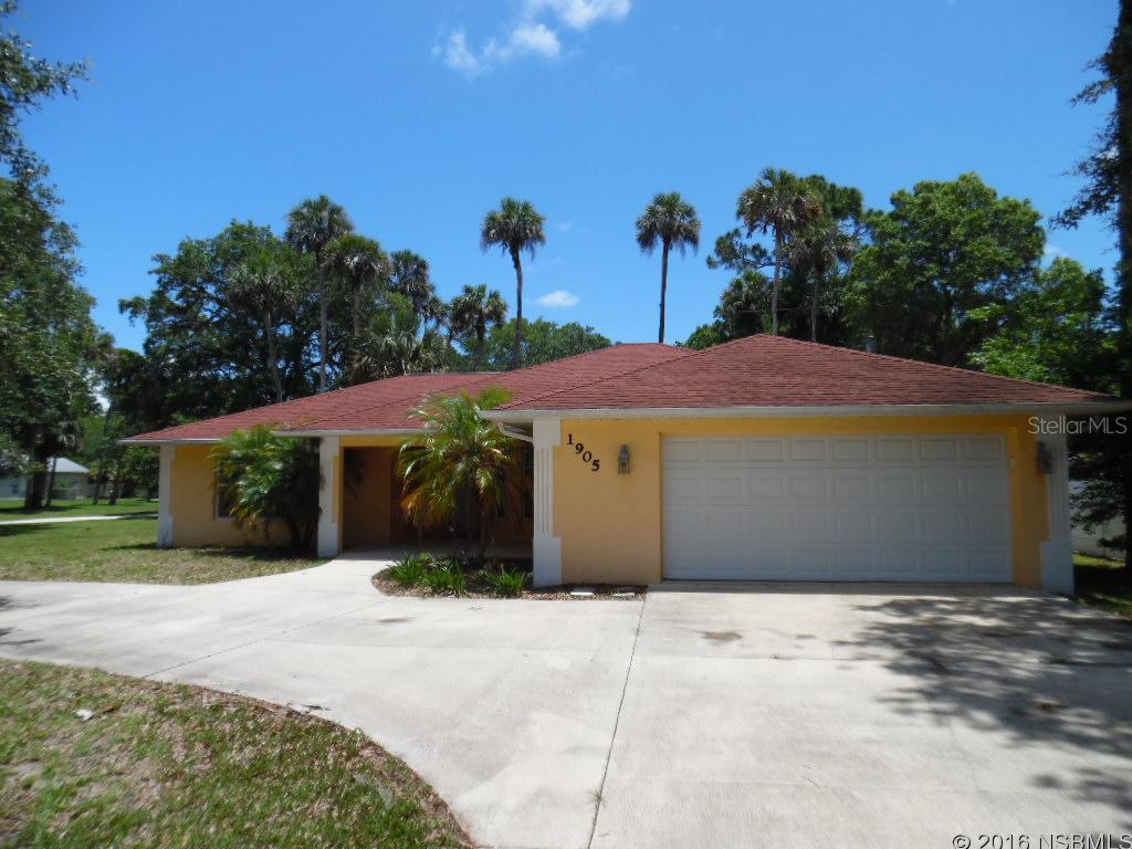Great looking newer home with curb appeal and circular driveway, located on an oversized corner lot and on a quiet, tree lined street. Open floor plan with a modern kitchen with island and breakfast bar, tiled eat-in area and spacious pantry. Open living and dining areas with vaulted ceiling, upgraded light fixtures and fans. Private Master Suite with large closet and walk-in shower. Two additional bedrooms with one full bath in a split bedroom plan. Sunny screened lanai overlooking the partially fenced back yard. A great property at a great price! All measurements approximate. ;Water: City