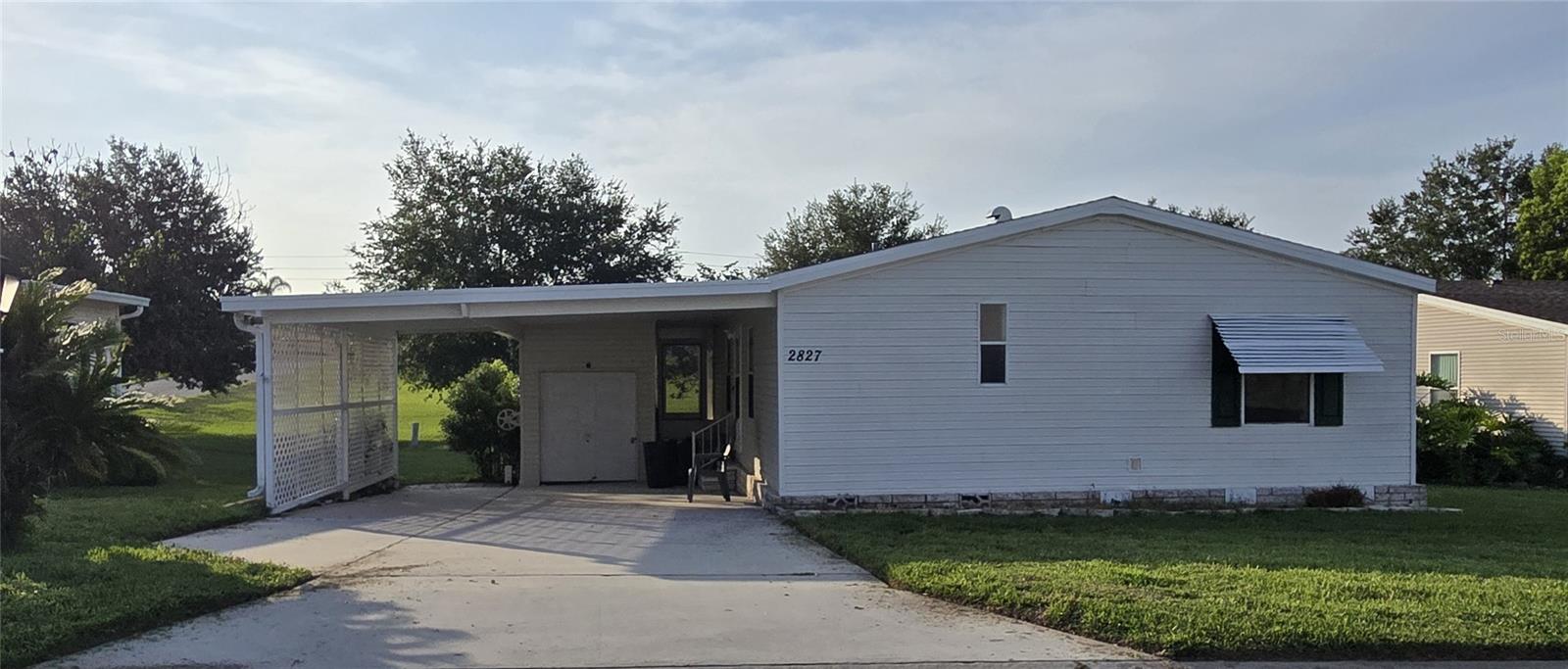 Zellwood Station, MOVE IN READY 3-bedroom 2 bath home, PET FRIENDLY, walking distance to Whistle Stop Restaurant, Golf Pro Shop, Pool, and mailroom. Split bedrooms, A/C 2019, Roof 2018, hot water heater 2026. New carpet in all 3 bedrooms, vinyl plank throughout rest of house. Inside laundry. Patio view of green space behind house. Open floorplan, large kitchen. $a415 month HOA (NO LOT RENT) includes lawn mowing, cable, internet and trash!  Zellwood Station is a Resident Owned 55+ Golfing Community located between Apopka and Mt Dora.  We have a 72 Par golf course, 4 pools, pickleball and tennis courts; water exercise and line dancing classes and our own Whistle Stop Restaurant and Lounge with banquet facilities.  There is always something to do here.  Close to the 429 for easy access to airports and attractions, we are close to shopping, restaurants, medical facilities and churches.  Come and see what we have to offer!