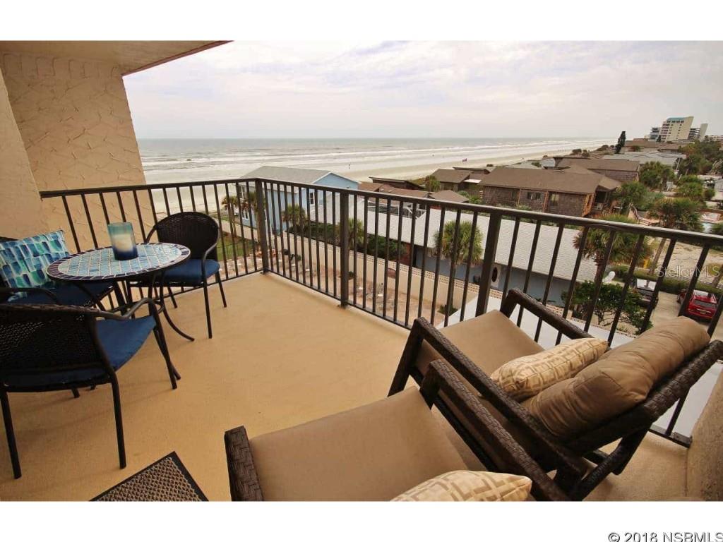 Ahhh...take a deep breath and feel the warm ocean breeze from your 5th floor balcony and enjoy the amazing views of the pristine, car-free beach in quaint and charming New Smyrna Beach. As you enter this beautifully remodeled 2 bedroom, 2 bathroom condo you will notice the new water resistant plank flooring that leads you to the spacious living area overlooking the ocean views. In the kitchen you will find Silestone countertops as well as plenty of cabinet space, a pantry and updated appliances.  The ceiling has also been updated including removal of popcorn and recessed electricity resulting in a knock down, smooth finish. Furnishings can be purchased to complete the move in package at an affordable price. Community features a pool, clubhouse, sunning area, lush landscaping and substantial seawall. Excellent rental income, great reserves, a well-maintained building and professional on-site management make this condo an outstanding vacation/second home or investment property. This is a great opportunity to own in one of the best coastal communities because this laid back beach town has it all...history, golf, diversity, outdoor activities, the arts, delicious restaurants, eclectic shops, sandy beaches, ocean breezes and warm Florida sunshine! ;LocationDescription: Condo ;Water: City