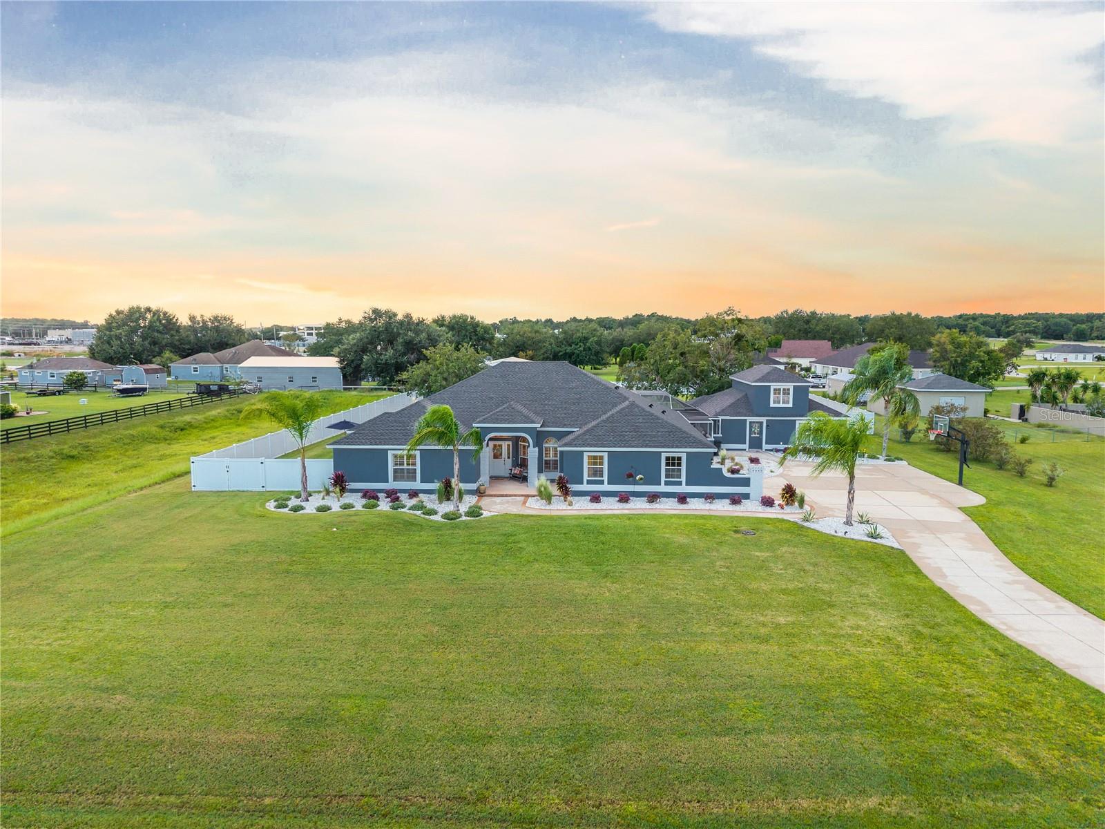 Stunning home now available in the desirable Fox Hollow Neighborhood. Looking for a beautifully updated home that checks all of your boxes??? Look no further. This 4 Bedroom, 4 Bathroom, 2 Office/Bonus Rooms,2 Car Garage, Pool and Spa home is sure to fulfill all your desires and needs. Complete with a very large Detached 30 x 36 Game Room (Added in 2007) that allows for endless entertaining possibilities. As well as the adjacent 61 x 47 lighted screen cage pool and spa area, that includes 2-quick disconnects for your gas grills/pizza oven. Currently has an electric heater for spa, but a gas line was added for a pool/spa gas heater if desired. The attached garage is currently being used as a gym. Garage door is insulated and pre-wired for a mini-split and has epoxy blue fleck flooring. - However, it can still be used as a garage. An additional 30 x 30 detached garage was added in 2024, located at the rear of the property. The detached garage has epoxy blue fleck flooring, 4 ceiling fans, laundry tub and storage above accessible by pull down stairs. So many upgrades in this home. New paint inside and out. New flooring. New light fixtures, fans, plumbing fixtures, door hardware, security cameras, kitchen and laundry appliances. Landscaping completely redone in October 2024 around entire home, detached garage, game room and shed. New roof shingles installed on home, game room, shed and detached garage in 2024. New tankless recirculating water heater added 12/2024. Whole house generator installed 9/2025. 500G underground propane tank installed 12/24. Backyard of home is completely fenced in with 6' vinyl privacy fence that was installed in 11/24. There is a drive thru gate on left side and a walk thru gate on right side. Ideally situated minutes from The Villages, you'll have easy access to shopping, restaurants and medical doctors and facilities. Plus you'll be conveniently located between Orlando and Ocala with less than a 10-minute drive to the Florida Turnpike and I-75. Don't miss out on this incredible opportunity to own this beautiful home in a sought-after neighborhood!