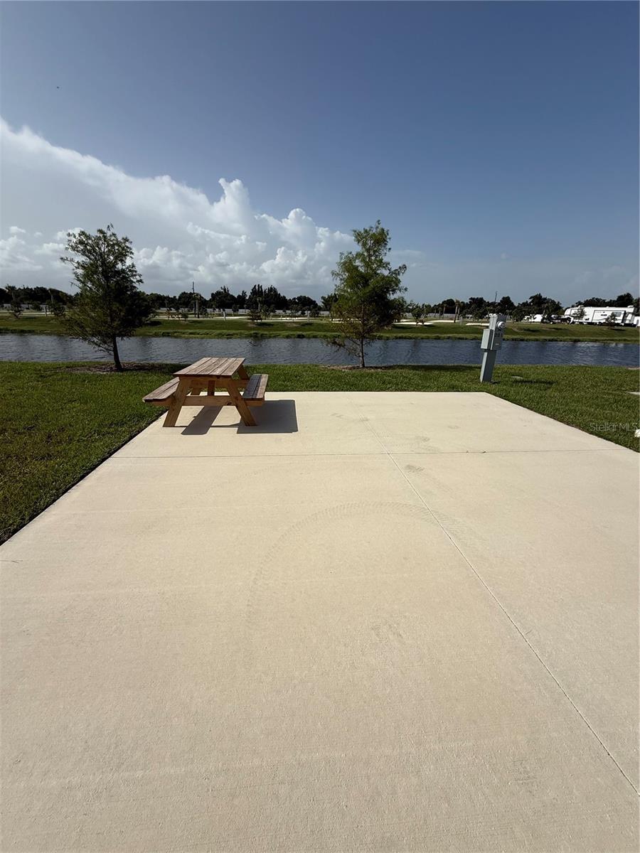 Own your own piece of paradise at this beautiful new luxury RV resort at Palm Breeze in Punta Gorda located just minutes from pristine beaches, waterfront restaurants, and endless coastal attractions. Enjoy resort-style living with outstanding amenities, including a stunning swimming pool, relaxing hot tubs, and our lively Tiki Bar featuring entertainment and social events. Stay active with pickleball, bocce ball, a putting green, playground, and spacious dog parks. Additional conveniences include an on-site café, laundry facilities, and much more. This Waterfront lot with no back neighbors offers added privacy with no rear neighbors, creating the perfect setting to relax and unwind. Whether you're looking for a seasonal retreat, vacation getaway, or investment opportunity, this luxury RV resort offers the ideal blend of comfort, recreation, and coastal living.
