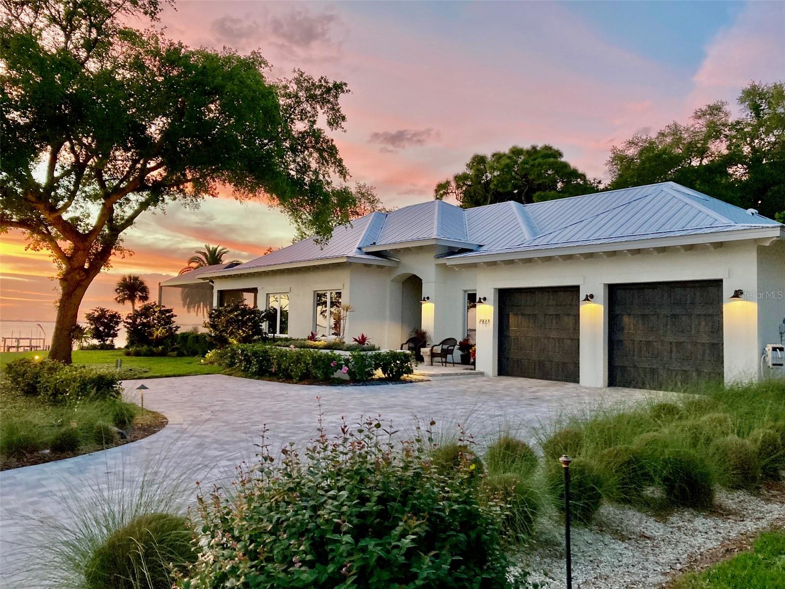 "The Ultimate Resilient Estate" – Experience the rare combination of coastal luxury, modern construction, and true peace of mind on Sarasota Bay. Built in 2019 to stringent CAT 5 wind standards and positioned at an impressive 14-foot elevation, this exceptional single-level waterfront residence offers a unique blend of luxury, resilience, and financial advantages, including no flood insurance requirement and low annual premiums. Notably, the home experienced no flooding during the 2024 hurricane season. This custom-designed 4-bedroom, 4.5-bath residence showcases soaring ceilings, rich cypress wood detailing, and walls of glass framing breathtaking panoramic views of Sarasota Bay. The thoughtfully designed floor plan features a luxurious primary suite with dual bathrooms and dual walk-in closets, creating a private retreat rarely found in waterfront homes. Outdoor living is equally impressive, highlighted by a spectacular 180-degree panorama of Sarasota Bay, a caged heated pool and spa, newer seawall, private dock, and direct access to boating, fishing, kayaking, paddleboarding, and other waterfront activities. A whole-house generator and spacious three-car garage further enhance comfort and convenience. Ideally situated within Sarasota's coveted North Bayfront Corridor and "West of the Trail" location, residents enjoy easy access to some of the region's most desirable destinations. More than a waterfront home, this is a resilient luxury estate designed for those who seek the very best of Sarasota Bay living. Offering a rare blend of luxury waterfront living and investment potential, this exceptional Sarasota Bay residence is located in a community that permits weekly rentals, creating unique flexibility for owners and investors alike. The property's direct bayfront setting, private dock and boat lift, expansive water views, resort-style pool, and newer construction make it highly desirable for luxury vacation guests seeking a premier Sarasota experience. Conveniently located near IMG Academy, downtown Sarasota, Longboat Key, St. Armands Circle, world-class beaches, and SRQ Airport, this property is well-positioned to attract seasonal visitors, boating enthusiasts, and extended-stay guests throughout the year. Whether enjoyed as a private waterfront retreat or utilized as an income-producing asset, this home presents an outstanding opportunity in Sarasota's luxury waterfront market.Optional culinary membership Sara Bay Country Club $35 per year.