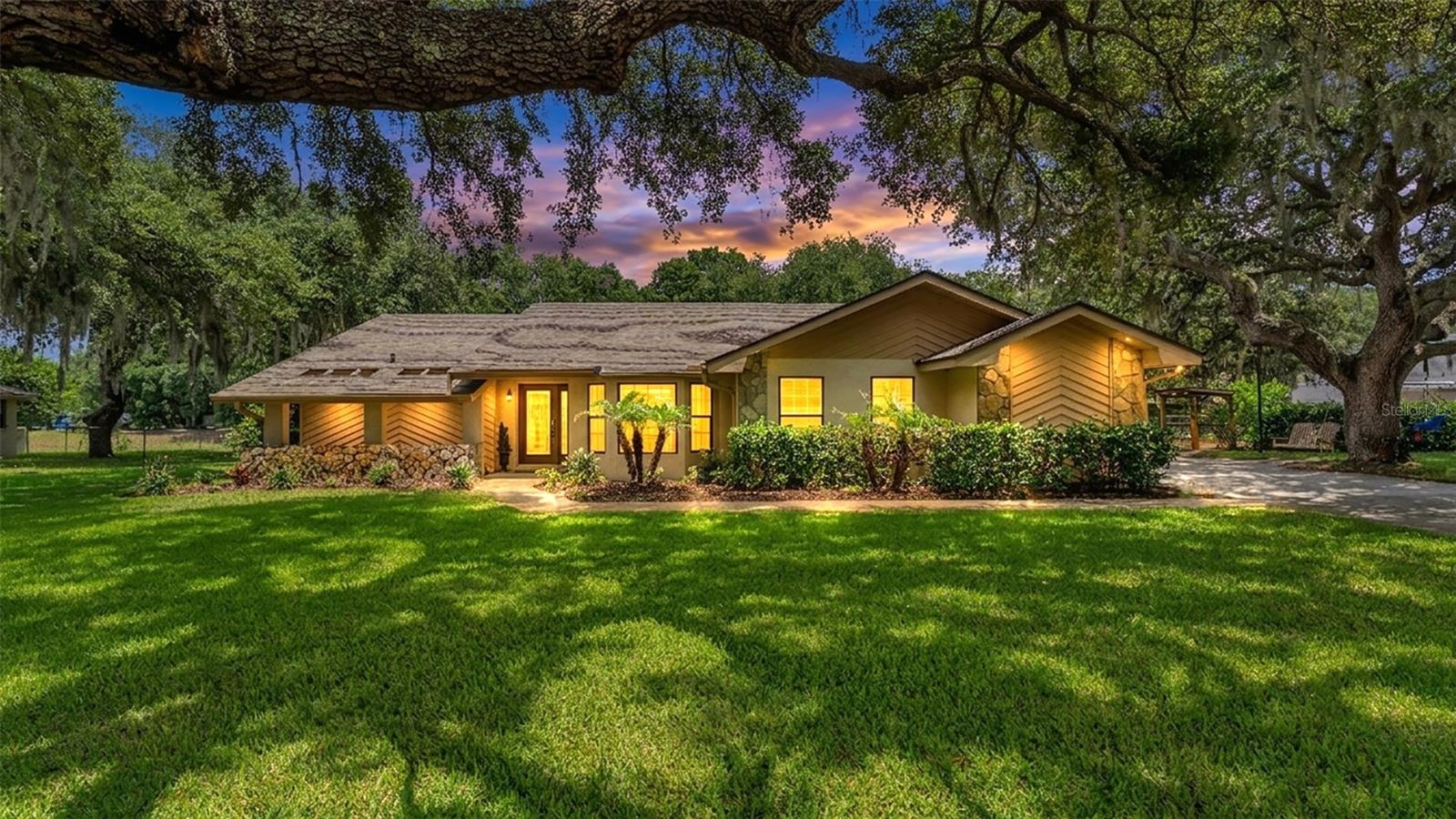 Beautifully updated 3-bedroom, 2-bathroom pool home on nearly half an acre with NO HOA! This well maintained property features numerous upgrades, including kitchen cabinets/countertops, updated bathrooms, and a cozy fireplace. It is the perfect mix of comfort, space, and privacy. Inside you will find a warm, inviting split floor-plan featuring a wood-burning fireplace and plenty of room for everyday living and entertainment. The spacious kitchen provides ample workspace while overlooking the dining room, living room, and pool! The primary suit is one of a kind with a stand-up shower, dual vanity, and stand alone tub, and walk-in closet. Step outside to enjoy your own private retreat starting with an oversized swimming pool, mature landscaping, and a large yar that is perfect for entertaining, or simply enjoying the outdoors. A detached garaged situated in the backyard provides excellent storage space, hobby room, or a workshop. With nearly half an acre, no HOA restrictions, and thoughtful updates already completed, this property offers a rare opportunity to enjoy both space and flexibility while still being conveniently located near shopping, dining, and everyday amenities. This is a home you will want to see in person!