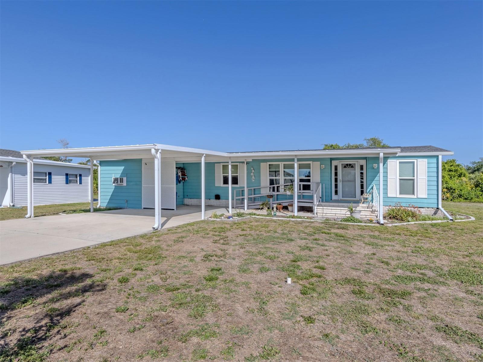 Set on a rare double lot overlooking the peaceful preserve, this exceptionally spacious 3-bedroom home offers both privacy and room to truly spread out in the highly desired, pet friendly, land-owned community of Harbor Isles. With serene views and thoughtful updates throughout, this property delivers comfort, functionality, and a beautiful natural backdrop.
Inside, the home welcomes you with a large, updated kitchen designed for both everyday living and entertaining. Enjoy tranquil preserve views while cooking, along with solid surface countertops, newer appliances including an induction cooktop, abundant cabinetry, and an oversized pantry that provides incredible storage. The expansive living area features vaulted ceilings and flows seamlessly through French doors into a stunning 280 sq ft Florida room. This light-filled space offers picturesque preserve views and is equipped with a 2-year-old mini split AC, making it comfortable year-round.
Along the rear of the home, you’ll find an additional 245 sq ft bonus room—ideal for crafting, hobbies, or creating extra living or workspace tailored to your needs. The spacious primary suite features a large walk-in closet and an ensuite bath with double sinks, offering both comfort and convenience.
Recent updates provide peace of mind and modern appeal, including new windows throughout, plywood subfloors, and laminate flooring in the main living areas. Major improvements have already been completed with tiedowns and vapor barrier, a 2020 AC system, 2022 roof, 2024 carport, and a hot water heater that is just 3 years old.
Located in Harbor Isles, residents enjoy a vibrant and active lifestyle with access to a marina, boat slips with direct access to the Myakka River and Gulf of Mexico, a large clubhouse, fitness center, heated pool and spa, tennis and pickleball courts, shuffleboard, and a full calendar of social activities. This sought-after community offers the perfect blend of relaxation and recreation, all just a short drive to Gulf beaches, shopping, dining, and everything Southwest Florida has to offer.
This is a rare opportunity to own a spacious, well-updated home on a premium preserve lot—offering both tranquility and an active Florida lifestyle.