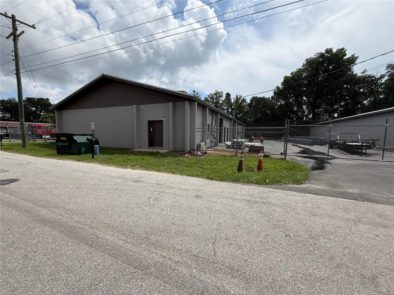 Available Now! Standalone 5,500 SF warehouse building featuring M-1 zoning and a highly functional layout suitable for a variety of industrial, manufacturing, storage, and distribution uses. The property includes three-phase power, one private office, three restrooms, and three grade-level roll-up doors providing convenient access for loading and operations. The property also features a fully fenced yard area offering additional outdoor storage, equipment space, or operational flexibility. This versatile industrial facility provides the ideal combination of warehouse functionality, power capacity, and secured outdoor space for a wide range of business needs.
