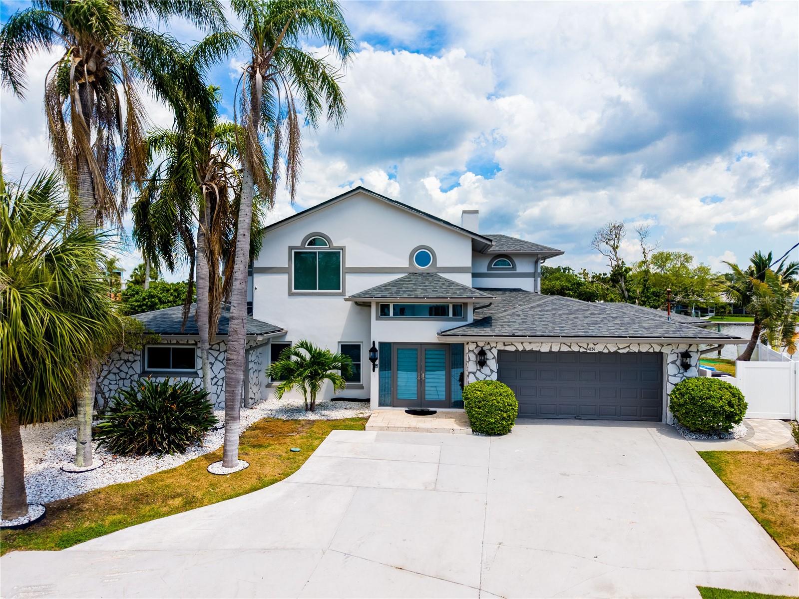 Experience waterfront perfection at this fully renovated masterpiece in Largo. Boasting an incredible 510 feet of wide-water views, this property is a boater’s dream, featuring two composite docks ready for your large vessels—and to sweeten the deal, the boat and all the furniture is included in the sale! Nestled on nearly 1/3 of an acre, this expansive residence features 6 bedrooms and 3 baths. Entertain in the outdoor oasis with a heated pool, spillover spa, and a massive 200+ sq. ft. second-story balcony offering breathtaking vistas.

A Rare Opportunity: This property is currently operating as a high-performing luxury short-term rental. Whether you are looking for an immediate high yield income property or your own private waterfront sanctuary, this home delivers. Sold fully furnished and completely "turnkey," it offers a seamless transition for investors or homeowners alike.

Beyond the lifestyle benefits, the property is built for long-term peace of mind and low maintenance: 2-year-old roof, impact-resistant windows and doors, new solar system, new HVAC, and hurricane-rated garage door. Schedule your private showing today to experience this unparalleled waterfront lifestyle and investment potential!