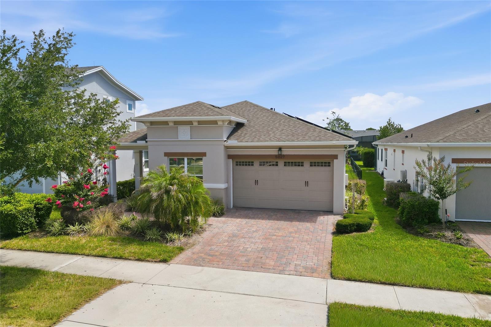 Virtually Staged. Experience the ease of resort-style living in this beautifully upgraded Palm Beach floor plan located within the gated 55+ community of Twin Lakes. Thoughtfully designed with a gourmet kitchen featuring upgraded cabinetry, granite countertops, custom backsplash, and a spacious island, this home blends comfort and style. Enjoy peaceful mornings on the screened lanai overlooking the outdoor living space, while the elegant primary suite offers tray ceilings, dual vanities, and a large walk-in closet. Twin Lakes residents enjoy exceptional amenities including a 20,000-square-foot clubhouse, resort and lap pools, fitness center, pickleball, tennis, walking trails, fishing, and access to Live Oak Lake with community boats. Conveniently located near Orlando, area attractions, beaches, and the airport, this is Florida living at its finest.