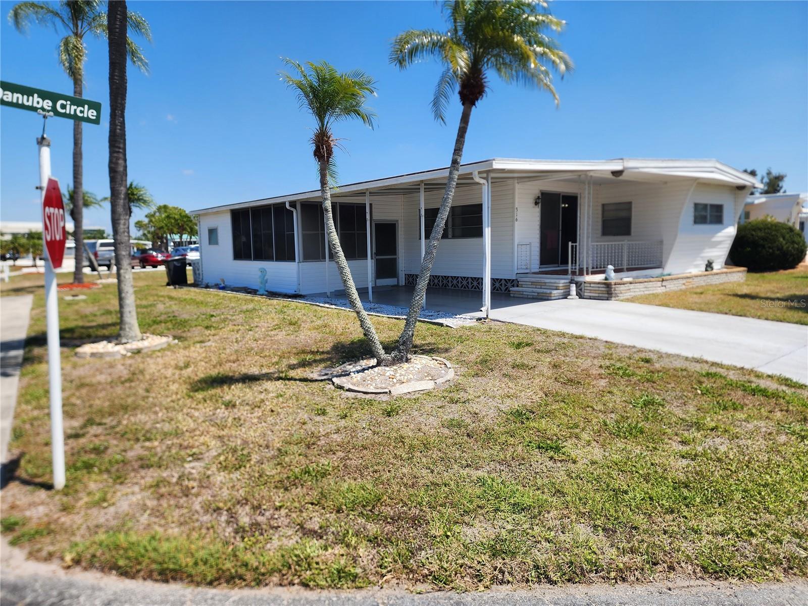 STOP SCROLLING — CORNER LOT • FURNISHED • STEPS TO THE POOL • NO LOT RENT!  This is the one buyers wait for—and they don’t last.  Perfectly positioned on a premium corner lot, this 2-bedroom, 1.5-bath home is being sold fully furnished, making it an effortless move-in or seasonal getaway. From the moment you walk in, you’ll notice the oversized bedrooms, open feel, and inviting layout designed for comfortable Florida living. The kitchen features a breakfast bar that flows into the living space—ideal for entertaining or casual everyday living. Plus, a new A/C unit means one less big-ticket worry.  But here’s what truly sets this home apart…  Step out your back door and you are just steps from the community pool—no driving, no hassle—just instant access to relaxation. Add in both front and back patios plus a vinyl-enclosed lanai, and you’ve got multiple spaces to enjoy the Florida lifestyle year-round. $250/month covers it ALL: Water, sewer, trash, cable, internet, on-site management, pool, shuffleboard, and even a convenient back gate entrance. Located minutes from shopping, dining, the airport, and the world-famous beaches of Anna Maria Island, this home is perfectly suited for snowbirds or full-time living. 
Low cost. Prime location. Furnished. Pool access. NO lot rent. ?? The combination buyers are searching for—and inventory like this is limited.  Don’t wait—homes in this location and price point move fast.

I