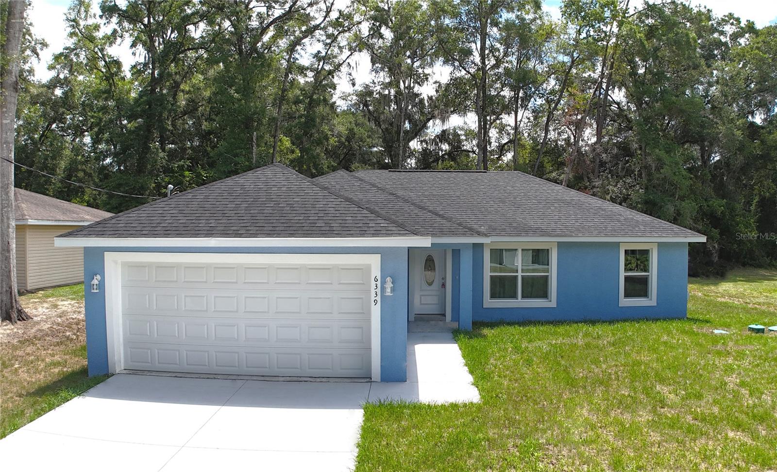 This beautifully crafted 3bd/2ba new construction is located at 6339 NW 52nd Ave. at the edge of an undeveloped section of Ocala Park Estates. This move-in ready newer construction and waiting for you. Fresh finishes, an open floor plan, and thoughtful design make this home feel anything but ordinary... and at a price point that's hard to beat. You're just minutes from the World Equestrian Center, top shopping, dining, and major transportation routes. New construction. Great location. Amazing value.