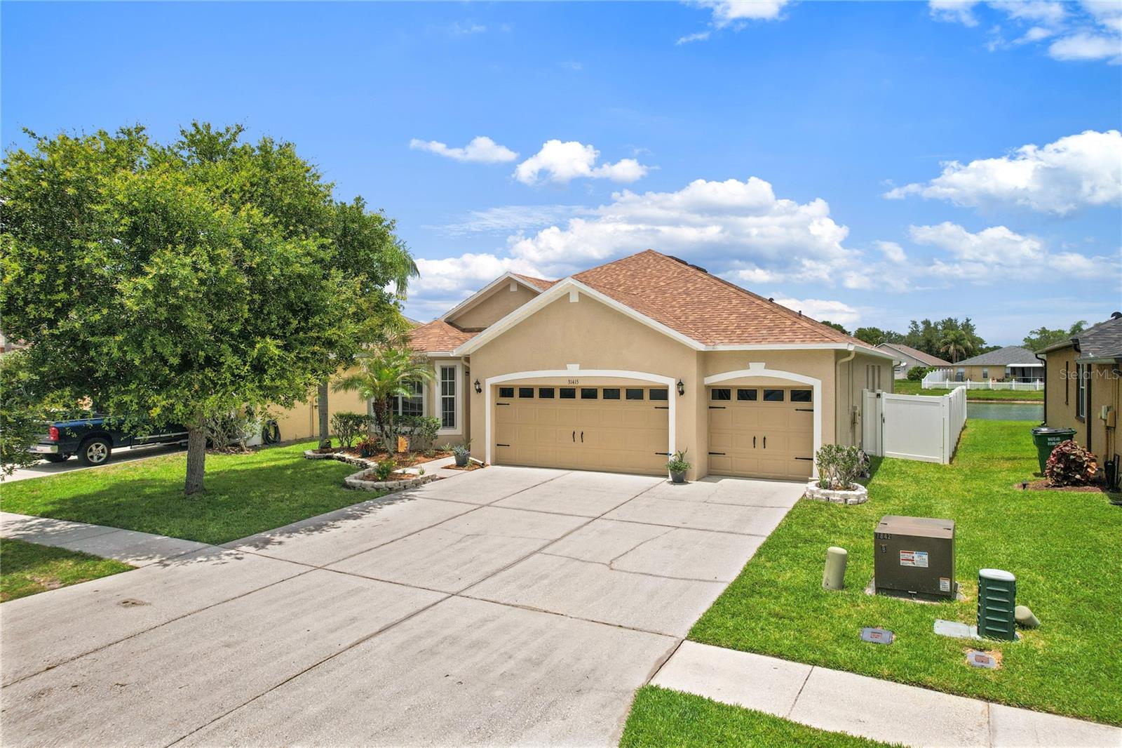 Move right into this beautifully updated and meticulously maintained home offering the perfect blend of comfort, style, and functionality! Enjoy peace of mind with a NEW roof (2025), NEW water heater (2025), fresh interior paint (2025), and NEW exterior paint (2026). The 3 car oversized garage (27'5"x 19'10") has also been refreshed with a tune-up and new springs (2026).

Inside, you’ll love the bright and airy open layout featuring NEW laminate flooring throughout with NO CARPET (2025), updated lighting, ceiling fans, faucets, and fixtures throughout. A huge bay window and several large picture windows fills the home with natural light, while the impressive triple 8-foot sliding glass doors create seamless indoor/outdoor living.

Designed with storage in mind, this home offers 8 closets plus a pantry, deep drawers in the primary bath, and linen closets in all three full bathrooms. All four spacious bedrooms include ceiling fans and custom closet organizers. Step outside to the screened-in patio featuring new weather-resistant flooring (2026), overlooking a tranquil pond and some of the area’s most beautiful sunsets. The fully fenced backyard includes 6-foot vinyl privacy fencing on the sides and a 4-foot rear fence, allowing unobstructed water views while maintaining privacy. The irrigation system has been serviced and programmed and does a fantastic job keeping the mature landscaping green and healthy. Enjoy mature landscaping throughout the safe and walkable neighborhood with wide sidewalks, huge playgrounds, parks, benches, tennis courts, and active lifestyle workout and green turf space. 

Additional highlights include a newer HVAC system (2014) that has been recently serviced, tray ceilings, high ceilings, light dimmers in most areas, NEWER APPLIANCES, DEEP SOAKING TUB with SEPARATE OVERSIZED TILED SHOWER in primary bedroom bathroom ensuite, OWNED SECURITY SYSTEM, Medicine Cabinets in all 3 baths, Fruit trees, and archways and niches throughout making this home truly move-in ready. With spacious living areas, abundant storage, and breathtaking pond views, 31415 Bridgegate Dr offers the ideal Florida lifestyle you’ve been waiting for.
4 Bedrooms | 3 Full Bathrooms | Pond View | No Carpet | Move-In Ready