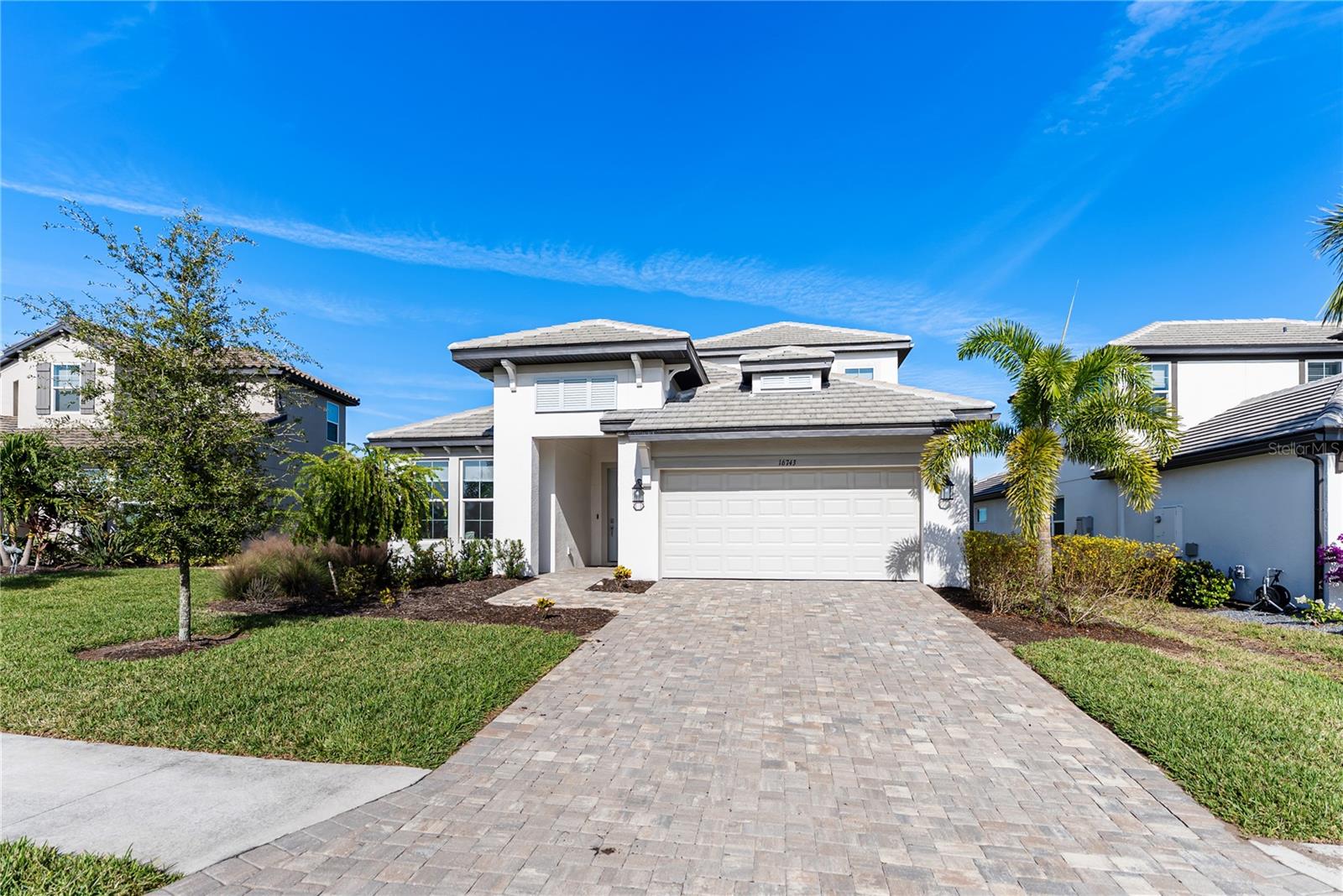 Welcome to this spectacular 5-bedroom, 4-bathroom residence, a true gem offering an elevated lifestyle in the vibrant Sweetwater community of Lakewood Ranch. As you step inside, you are immediately greeted by the bright and airy atmosphere created by the large, open-plan design, a configuration perfect for effortless entertaining and comfortable daily living. The heart of the home is the gorgeous gourmet kitchen, which is a masterpiece of design and functionality, featuring a spacious center island, sleek white cabinetry, and top-of-the-line finishes that will inspire any culinary enthusiast. This is truly a space where memories will be made. A highly desirable and essential feature of this floor plan is the magnificent Owner's Suite, thoughtfully located on the ground floor and strategically positioned on its own private wing of the home for ultimate peace and quiet. This awesome suite is a peaceful sanctuary, complete with a huge walk-in closet offering ample storage and a spa-like gorgeous ensuite bathroom boasting elegant dual sinks and a large, rejuvenating walk-in shower. The upstairs living area is equally impressive, hosting a large family room, providing a wonderful secondary space that can be utilized as a media center, a game room, or simply a relaxed area for unwinding. Outside, you can savor the tranquility of your private lanai, offering serene, peaceful views overlooking the lush preserve, the ideal setting for enjoying your morning coffee or an evening cocktail while taking in the natural beauty. The home's location is superb, ensuring you are zoned for the highly anticipated brand-new Lakewood Ranch K–8 school, simplifying the school routine. Beyond the property itself, residents of Sweetwater gain exclusive access to a collection of first-class amenities, elevating the daily routine into a permanent vacation. These community features include a resort-style heated pool, a multi-purpose sport court, fun pickleball courts, a gated recreational field, a fantastic social gathering space, and a state-of-the-art 24-hour fitness room. This exceptional residence offers an unparalleled opportunity to live in a highly sought-after community, providing all the modern luxuries, space, and conveniences you could ever desire.