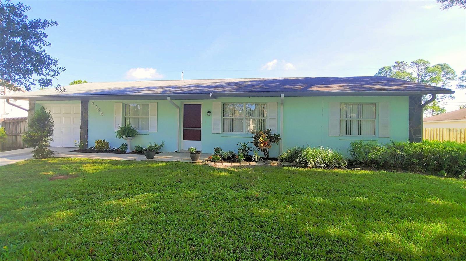 Great home in a great location! This 3 bedroom, 2 bathroom concrete block home is ready to move in! Featuring contemporary tile throughout, an open great room, private back porch with new screens, privacy fence (on sides and back of yard), new water heater, new toilets, beautiful counter tops in kitchen and bathrooms and an oversize 1-car garage. A fantastic mature oak tree in front yard provides plenty of mid-day and afternoon shade and new landscaping sets off the front of the home beautifully. The large master bedroom has a walk in closet. This lovely section of Yule Tree Drive is pleasantly shaded with an oak canopy and sees minimal traffic; Publix, restaurants, True Value Hardware, newly renovated Whistle Stop Park and Indian River Elementary School are all within 1.5 miles. (Room measurements are rounded to nearest foot) ;Water: City