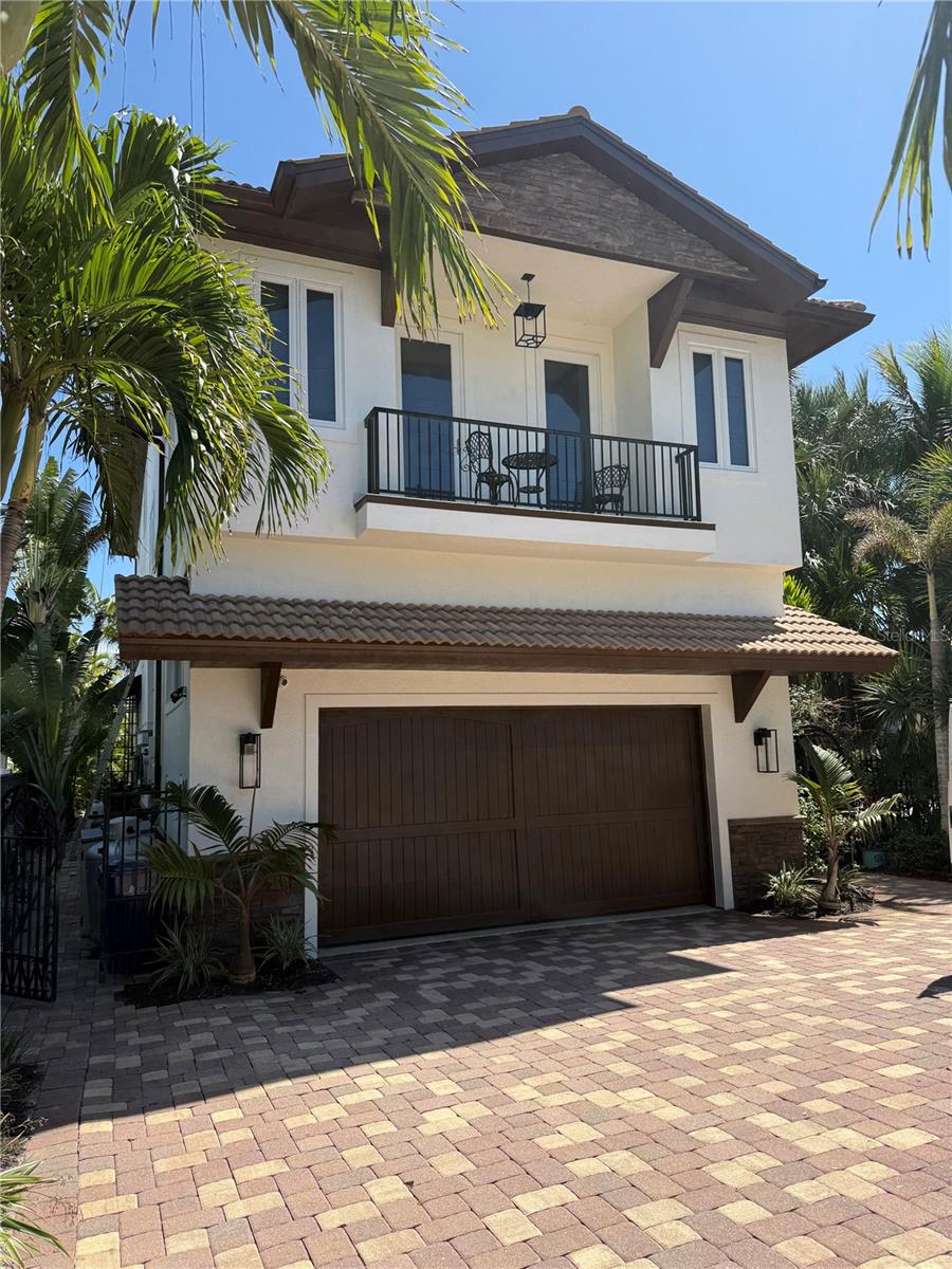 Paradise found! This stunning, sturdy and stylish home has undergone extensive renovation, but the position of this home on the Grand Canal is the true show stopper. Just one bridge separates you from the crystal blue waters of Roberts Bay. A corner lot with boating waters to the east and south means panoramic views of the deep water canal. The pool, spa and gorgeous paver deck will be your favorite spot to relax and watch boat traffic. For boat enthusiasts, your dock with a lift for a boat and a jet ski are ready for you. Two floors of luxury living with an extensive non-conforming space on the lower level, this home is perfection for the full or part time island dweller with dreams of enjoying life to the fullest on sunny Siesta Key!