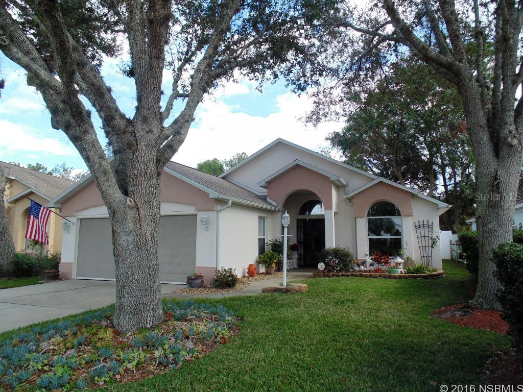 Lovingly maintained home in quiet neighborhood in the heart of New Smyrna Beach!  Enter into a large living room with volume ceilings with 2 sun tunnels for added natural light.  Kitchen has quartz countertops and wood cabinets.  You'll love the kitchen bay window - perfect spot for breakfast nook.  There's even a moveable island that stays with the house!  Family room has two walls of windows and opens into 14x14 screen porch.  Family room has vinyl plank floors. French doors lead to master bedroom!  Walk in tile shower in master bedroom.  Master bedroom has engineered wood floors.  Back yard is so lovely with PVC fence around perimeter.  Home has a whole house surge protector, transferrable termite bond, 2008 HVAC, 2012 roof! Hurricane windows installed master bedroom and family room in 2008. Garage has electric screen door. Centrally located, easy access to State Road 44, close to shopping, golf course and dining. ;Water: City