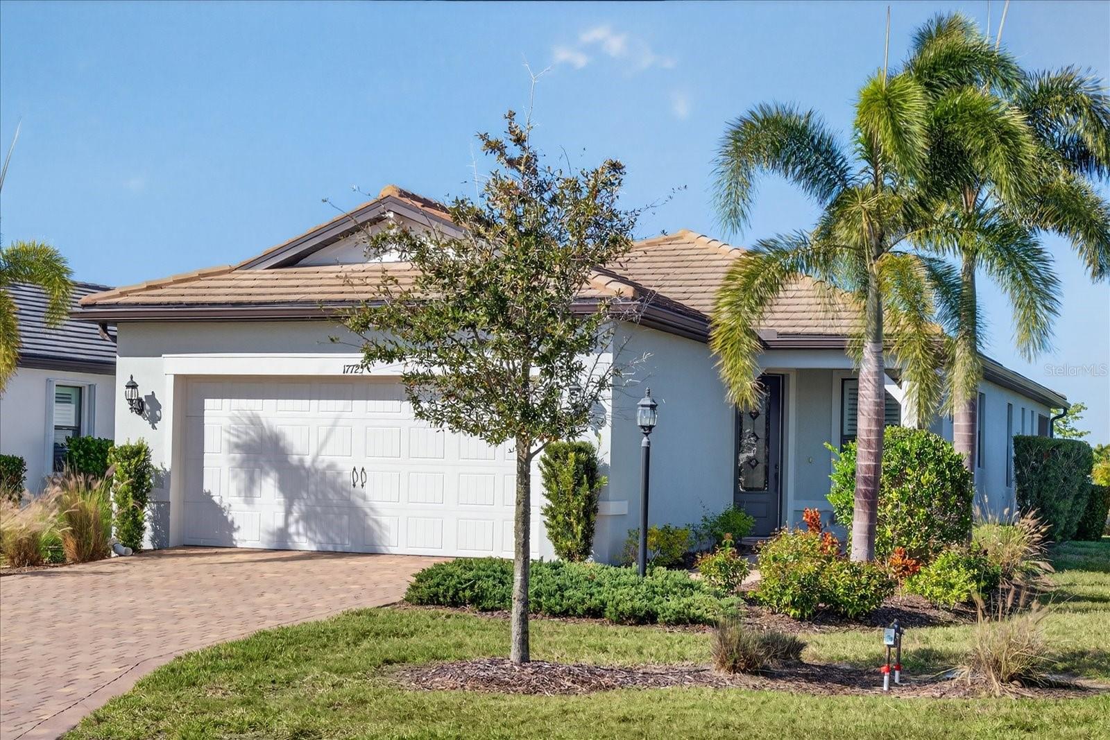 No Waiting---Your Dream Home Is Ready Now! Skip the build time and step right into this
beautifully upgraded, move-in ready 1,405 sq ft Pulte Contour Model, ideally located near lush
landscaping and tranquil water views in the highly sought-after Del Webb 55+ community of
Lakewood Ranch---part of the nation’s #1 multi-generational master-planned development. This
stylish residence features 2 bedrooms, 2 bathrooms, a den, a 2-car garage with epoxy floors, and
an extended lanai, offering the perfect balance of luxury, comfort, and modern design. From the
moment you arrive, you’ll be impressed by the home’s attractive elevation and stunning glass
front door, setting the stage for what awaits inside. The interior is both warm and inviting,
showcasing medium-toned ceramic tile flooring throughout the main living areas, complemented
by plush carpet in the bedrooms and den. The open-concept living space centers around a well-
appointed gourmet kitchen featuring 42” light cabinetry, KitchenAid stainless steel appliances, 5-
burner gas cooktop with stainless steel hood, granite countertops, and a large center island with
seating for two and additional storage---perfect for entertaining or everyday living. The private
owner’s retreat offers peaceful water views and a spa-inspired ensuite with dual sinks, a granite
vanity, a large walk-in shower with a handheld and grab bar, and a large walk-in closet with
ample space for storage. A thoughtfully placed guest bedroom provides comfort and privacy for
visitors. Outdoor living shines with the extended lanai, an ideal space to relax or entertain while
enjoying the serene water views and Florida lifestyle. Don’t miss this opportunity to own a
move-in ready home in one of Florida’s most desirable communities. Schedule your private tour
today!
